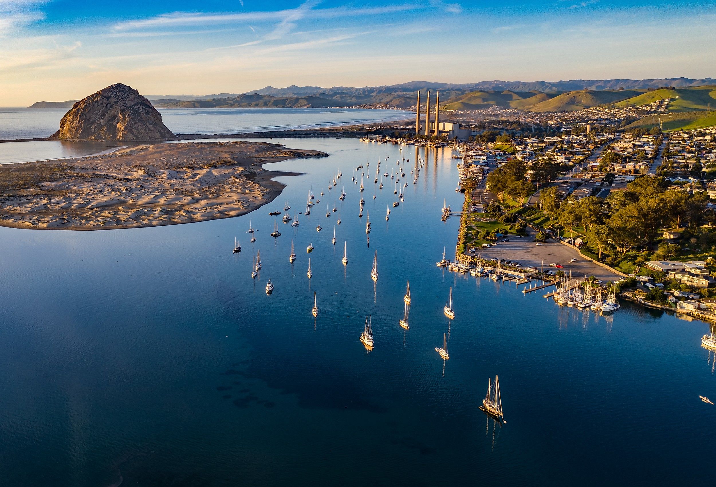 Sail boats in the water in Morro Bay, California.