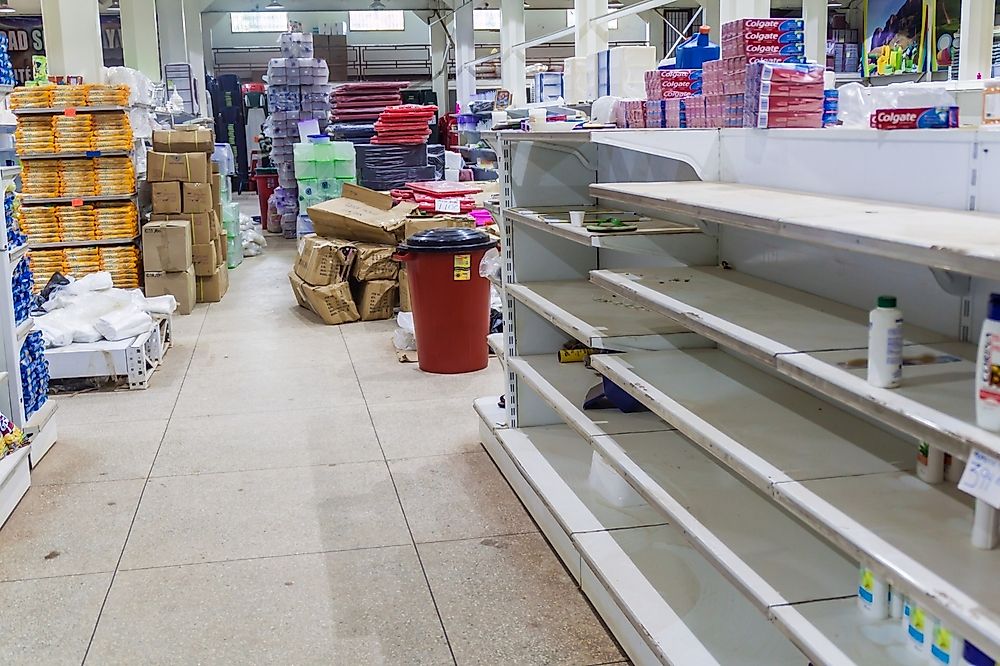 An empty supermarket in Venezuela. Editorial credit: Matyas Rehak / Shutterstock.com.