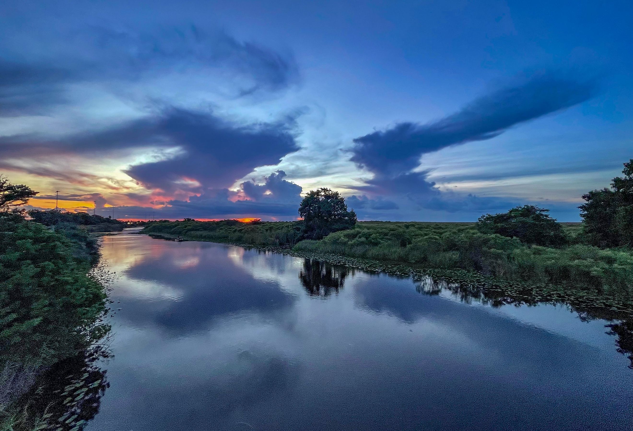 Swamp sunset and hurricane clouds in Covington, Louisiana.
