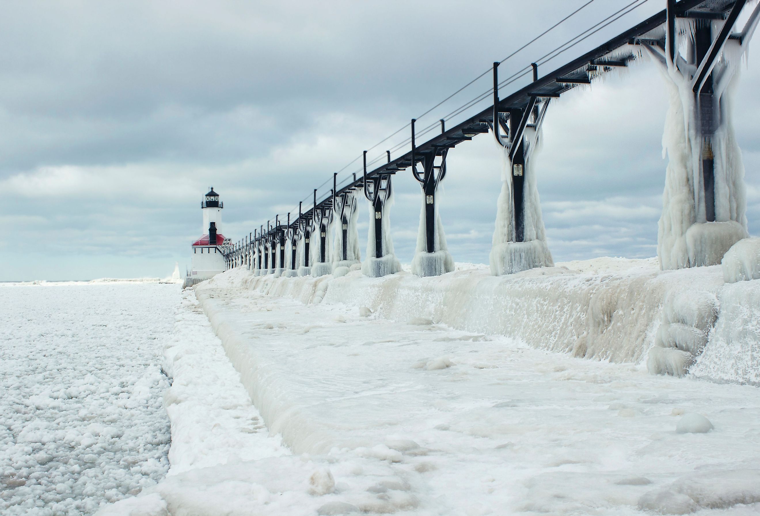  Michigan City, Indiana lighthouse surrounded by frozen Lake Michigan. Image credit Tammy Chesney via Shutterstock.