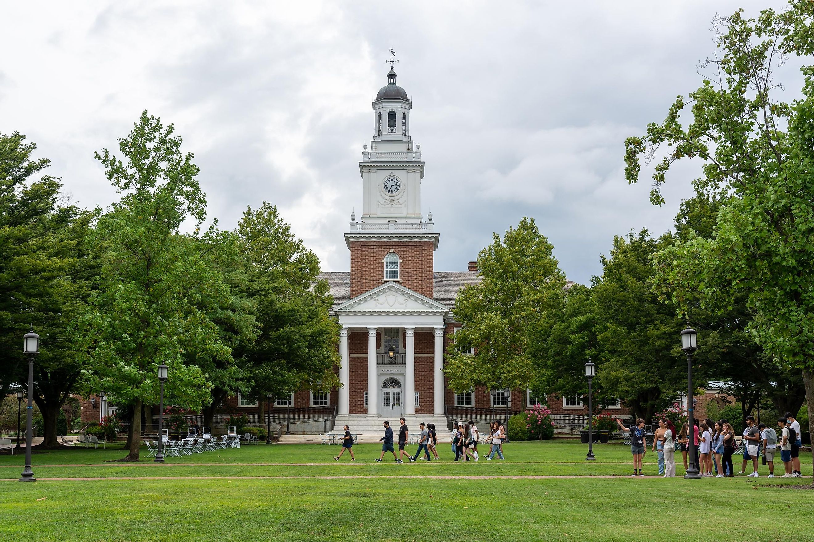 New students walk past Gilman Hall on the Johns Hopkins University campus in Baltimore during first year orientation. Editorial credit: Liz Albro Photography / Shutterstock.com