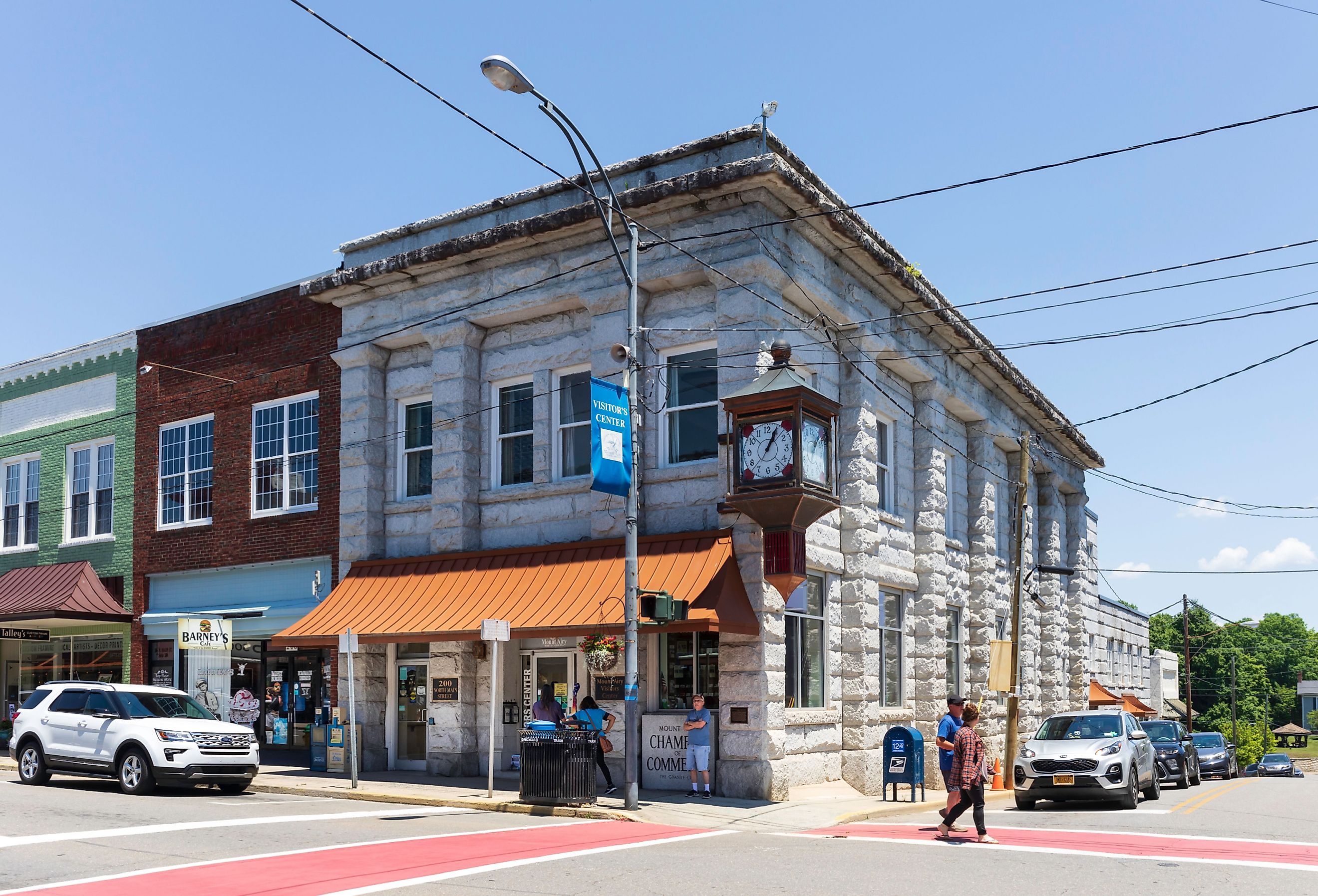 he Mount Airy Chamber of Commerce and Visitors' Center sets on Main Street, next to Barney's Café. People. Image credit Nolichuckyjake via Shutterstock.