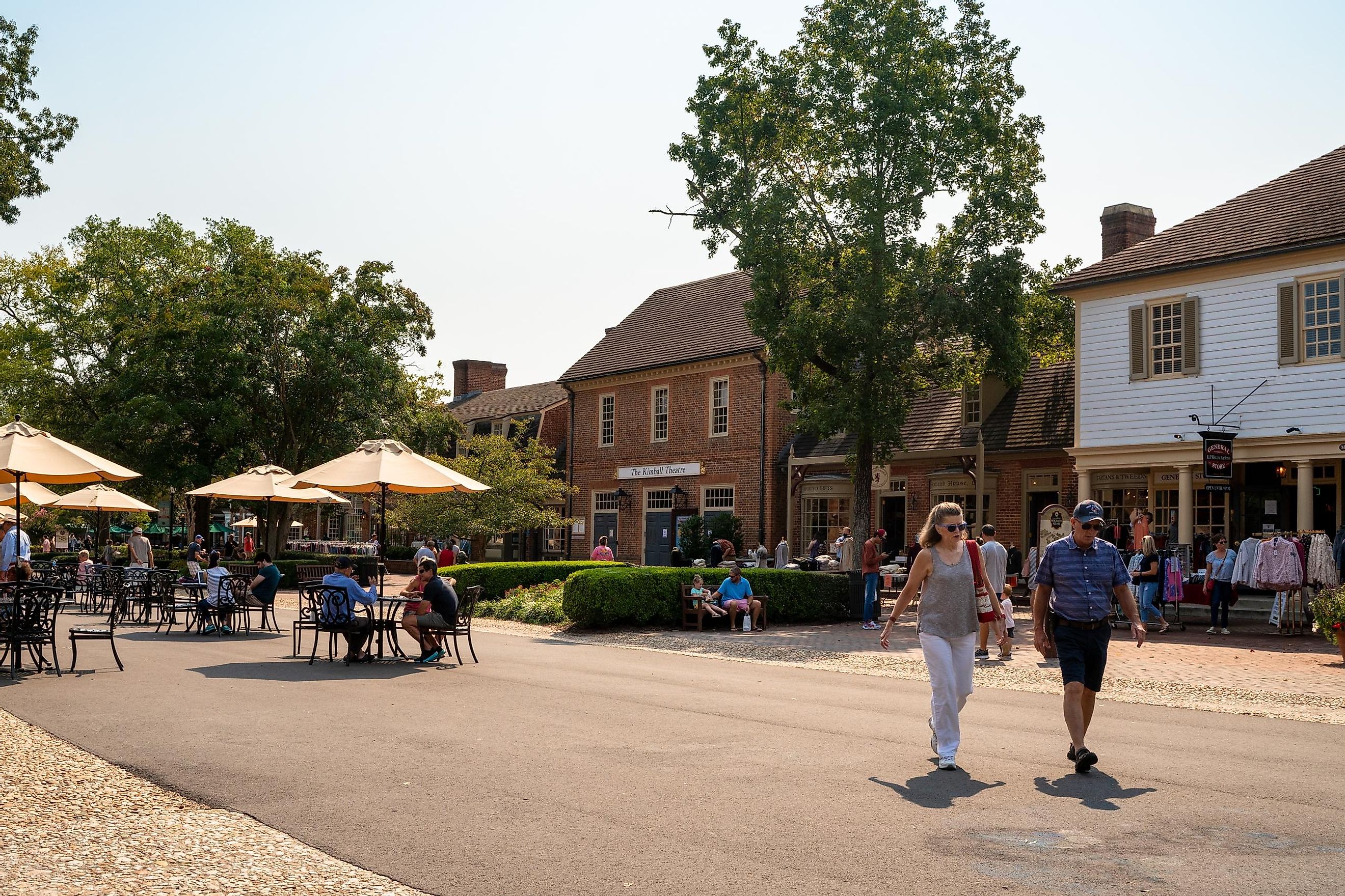 Street scene from historic Williamsburg Virginia at Merchants Square with people visible.