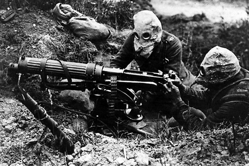 British machine gunners wear masks in their trench positions to defend against German gas attacks in the Battle of the Somme.