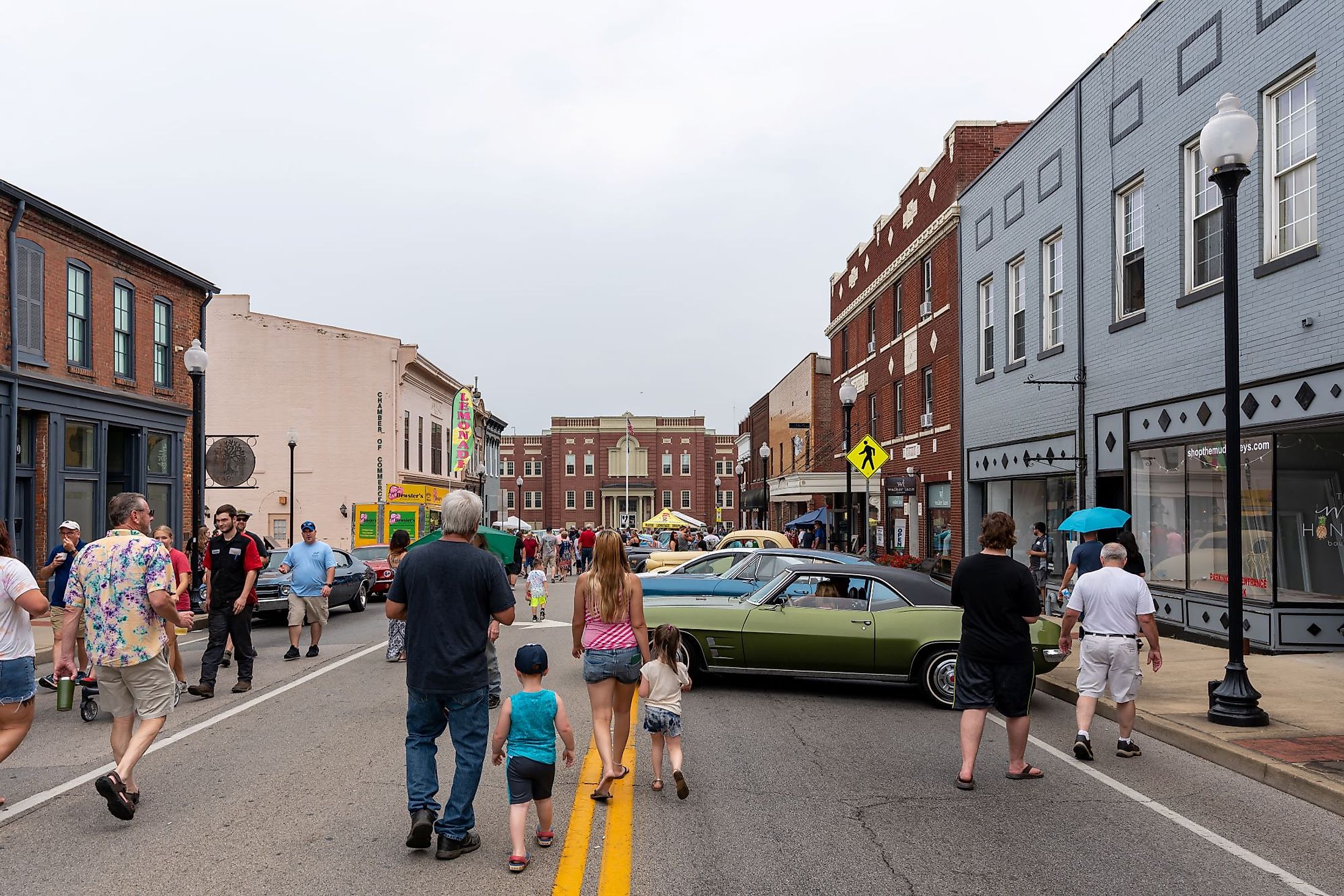 Spectators walk in the streets with cars on display during the Cruisin' The Heartland 2021 car show in downtown Elizabethtown, Kentucky. Editorial credit: Brian Koellish / Shutterstock.com