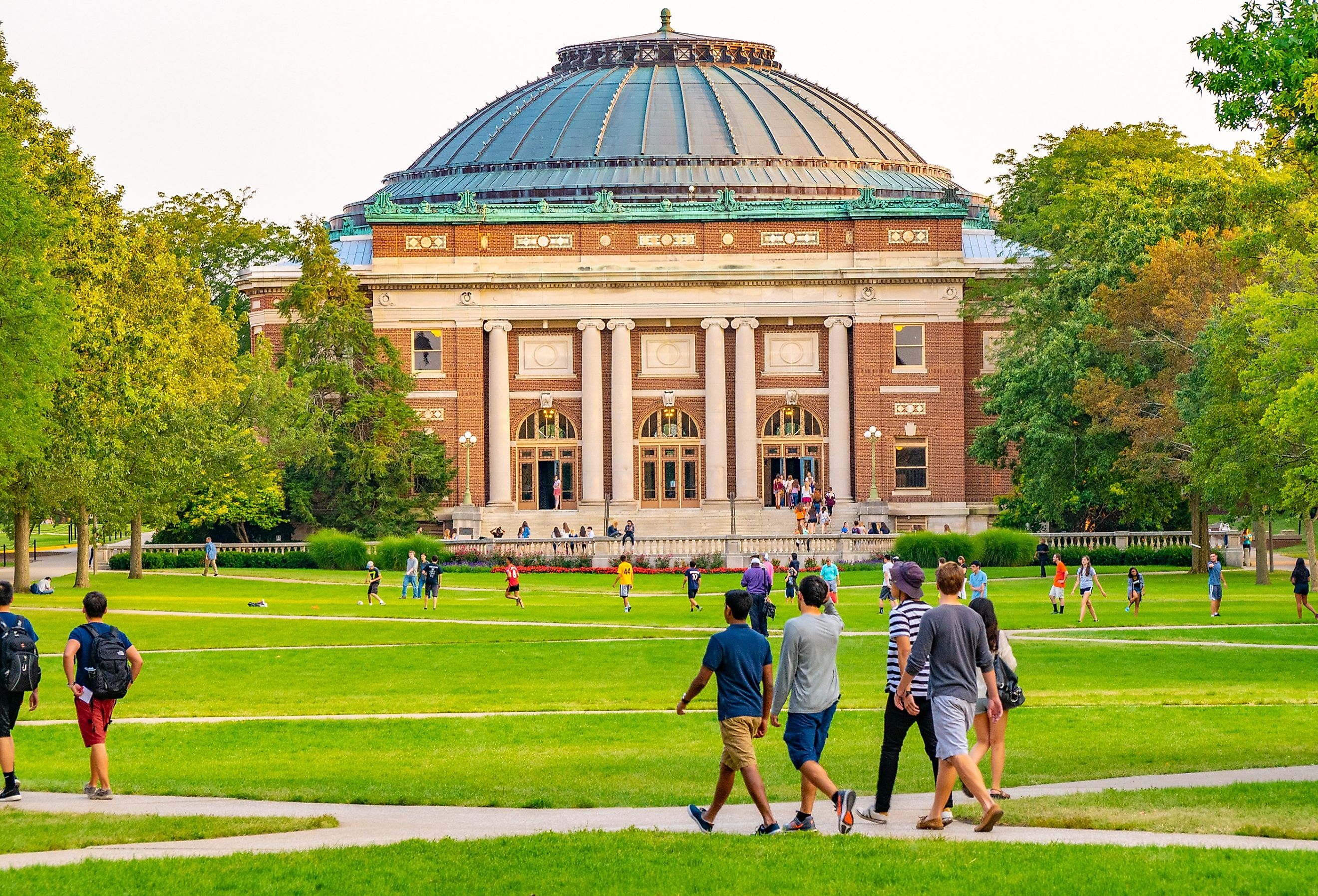 College students walk on the quad lawn of the University of Illinois campus in Urbana, Illinois.