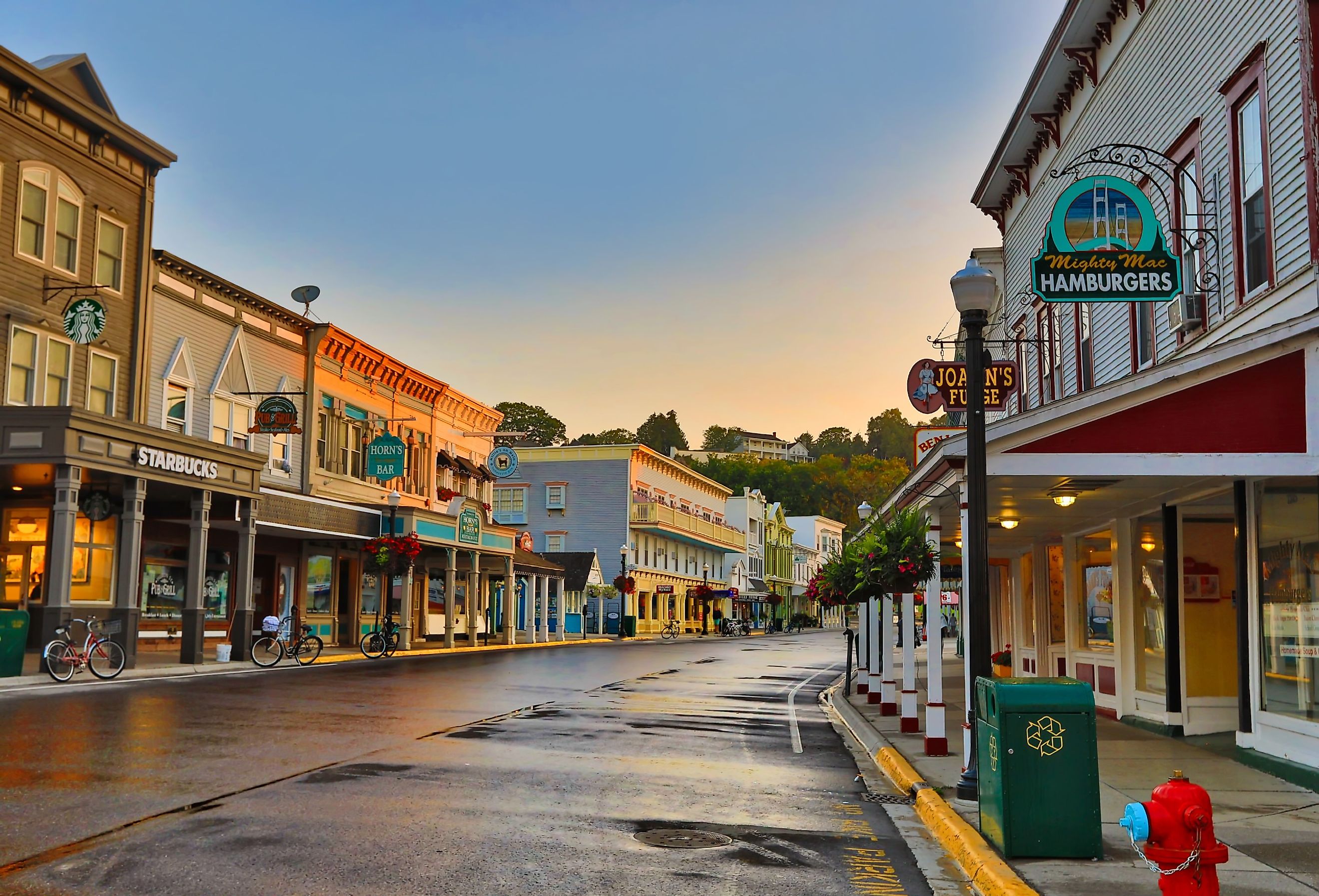 The main street of Mackinac Island, Michigan, full of quaint shops and restaurants. Image credit aceshot1 via Shutterstock