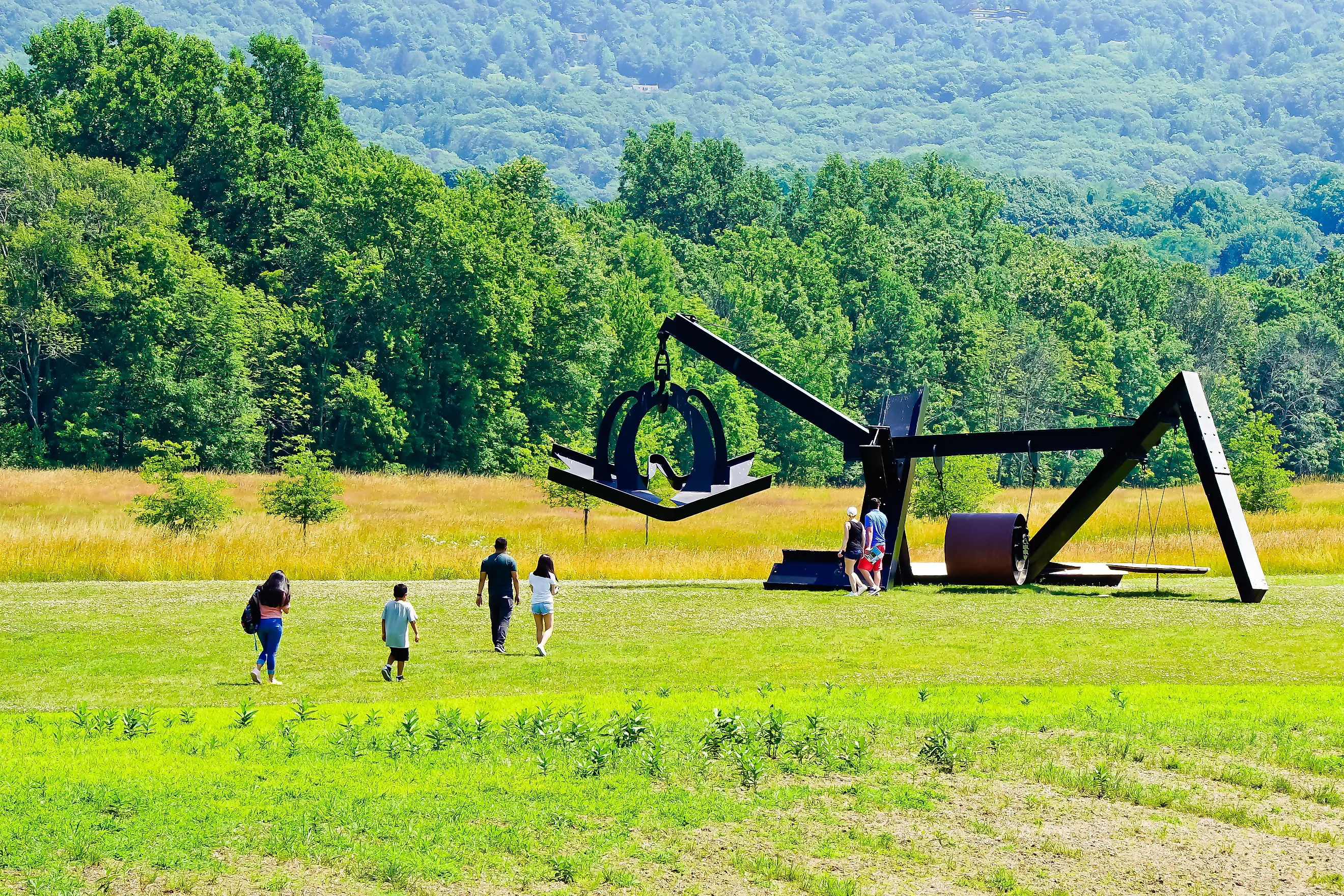 Mountainville, New York/United States-7/7/2019: tourists visiting new addition of sculpture of “she” by Mark DI Suvero in storm king art center. Yingna Cai via Shutterstock