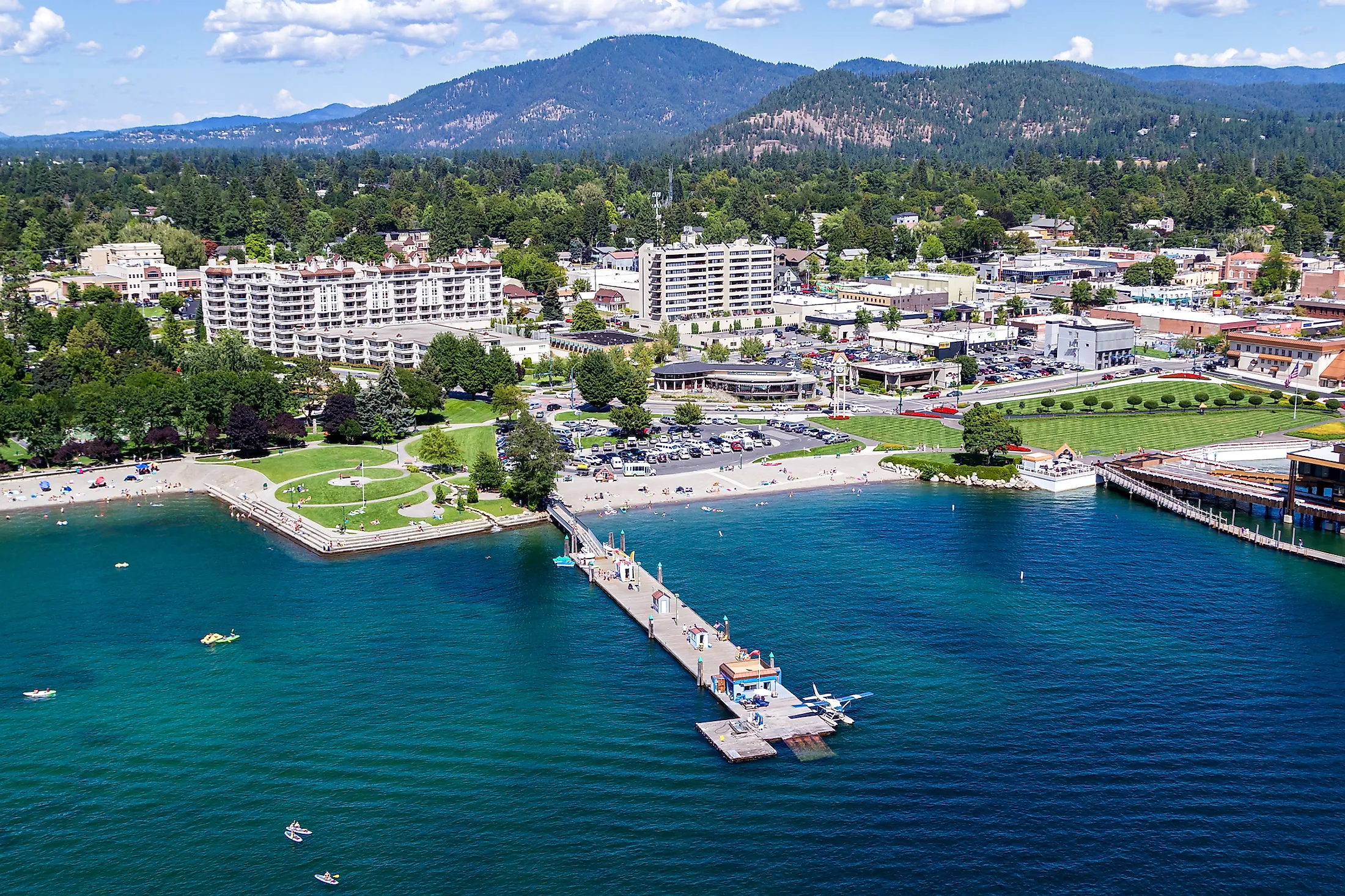 Aerial view of the beach with families enjoying the sunshine and lake. Editorial credit: Nature's Charm / Shutterstock.com