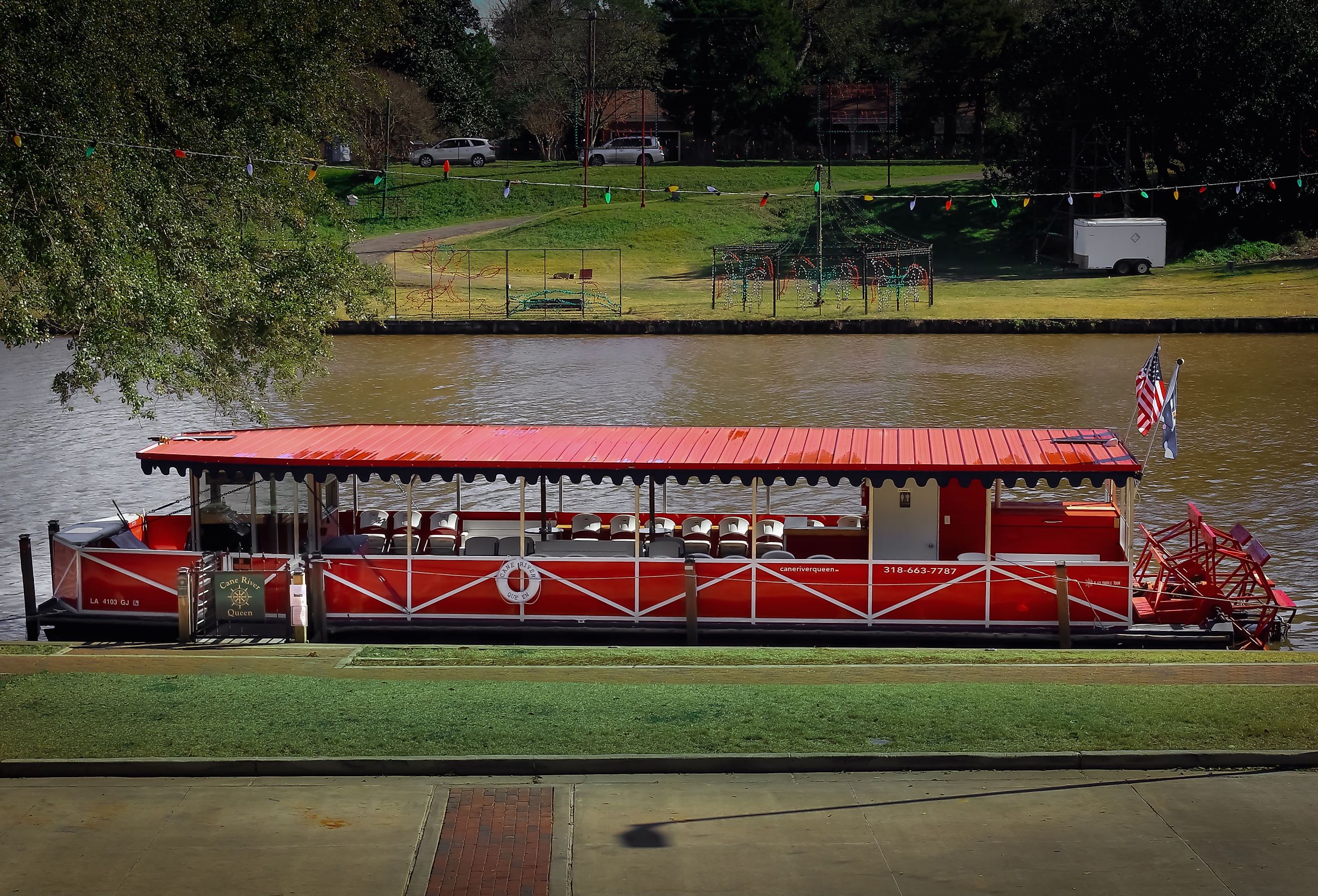 A boat on the Cane River below the town strip, Natchitoches, Louisiana. Image credit Sabrina Janelle Gordon via Shutterstock