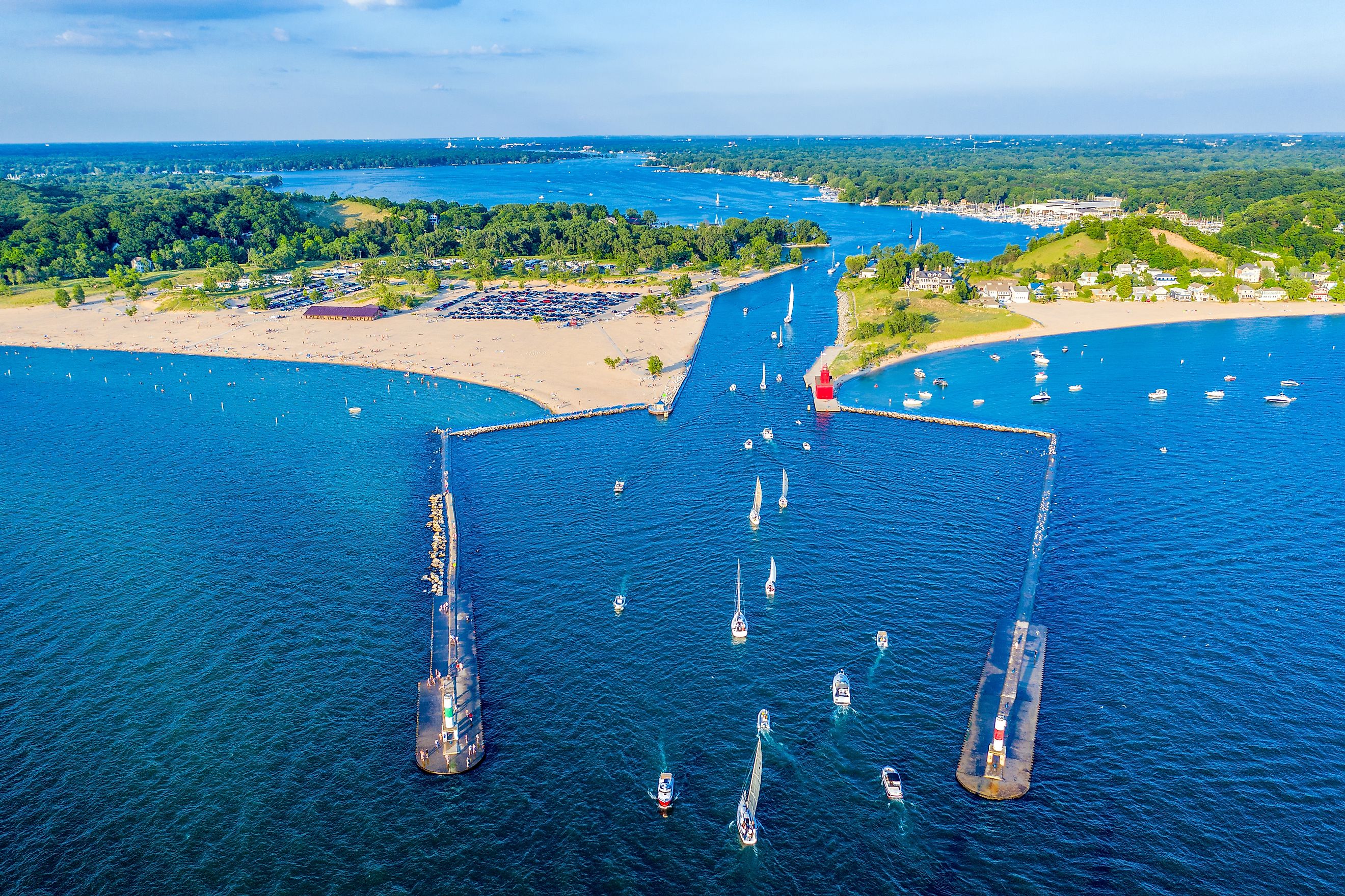 Aerial view of the Holland Harbor Lighthouse at the channel connecting Lake Macatawa with Lake Michigan in Holland State Park, Michigan.