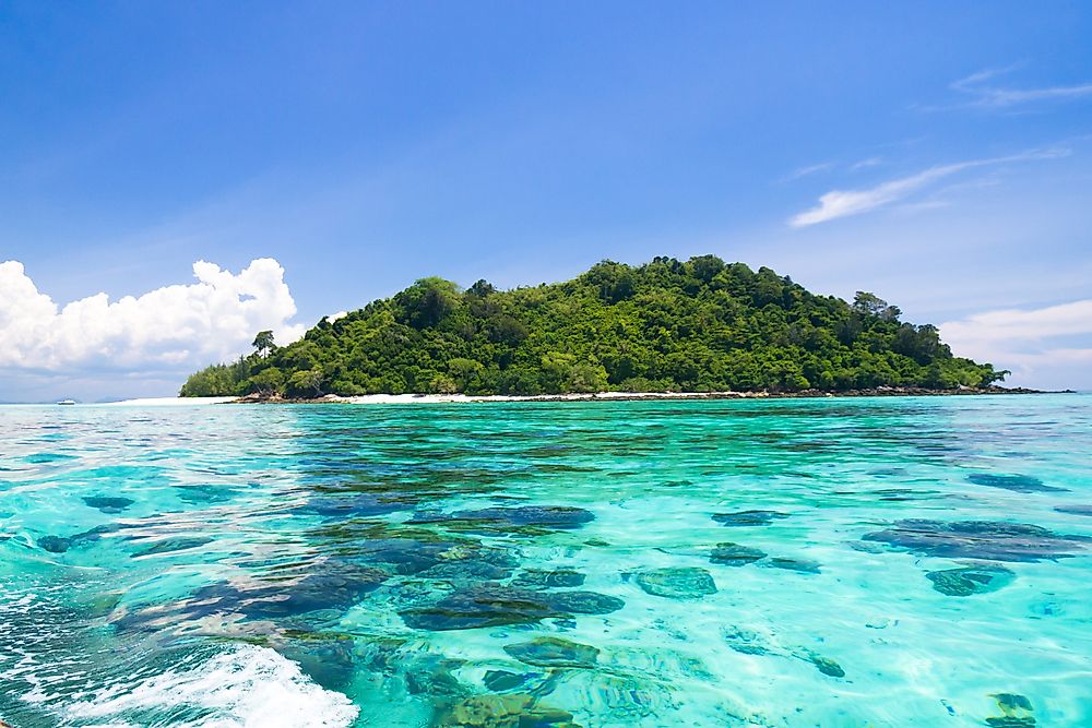 An island is broadly defined as an area of land surrounded by a water body.