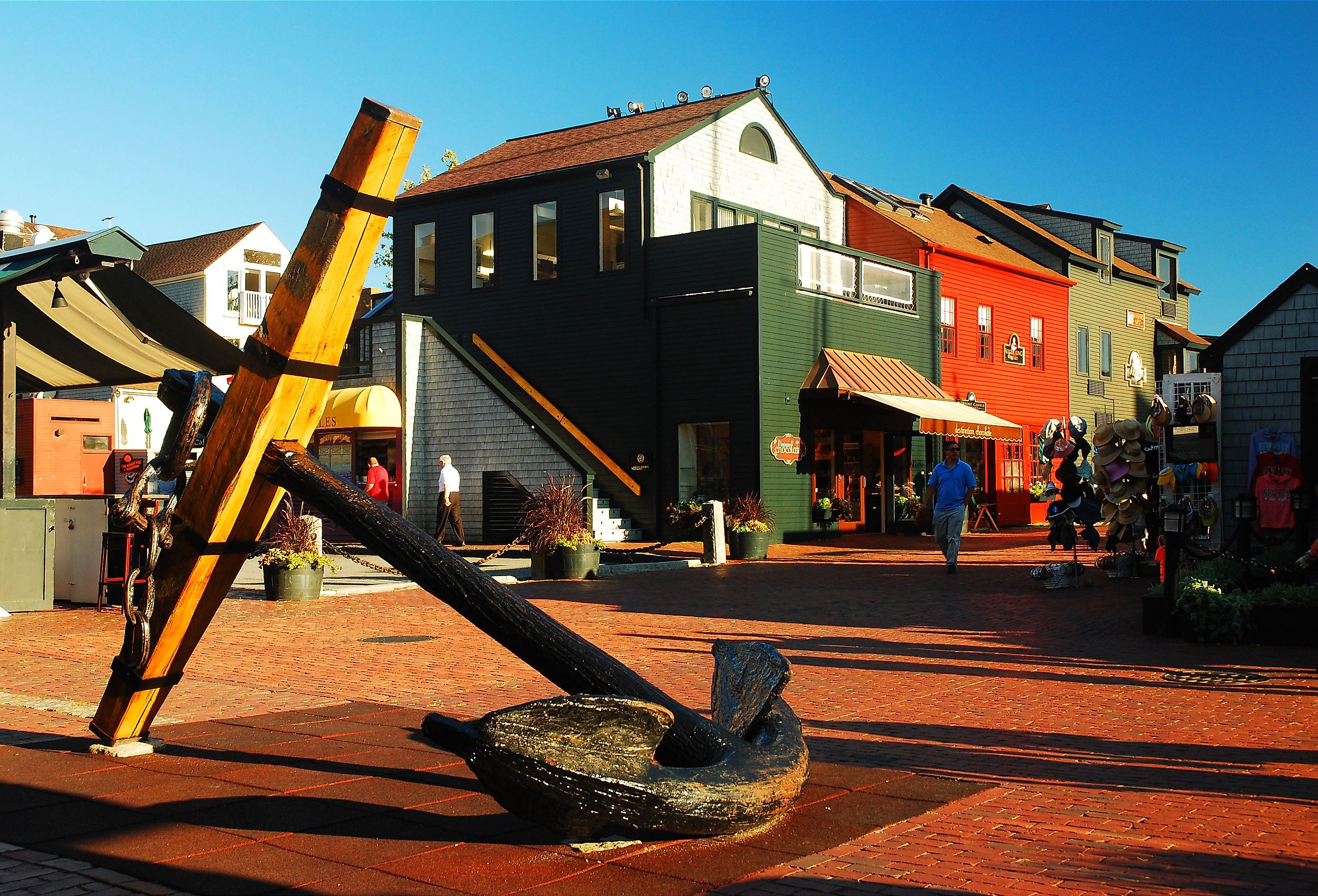 A historic anchor is a centerpiece of Bowens' Wharf, a shopping and dining district in Newport, Rhode Island. Image credit James Kirkikis via Shutterstock