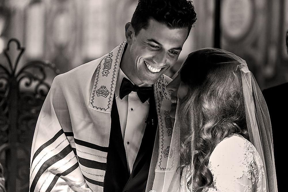 A bride and groom at a traditional Jewish wedding.