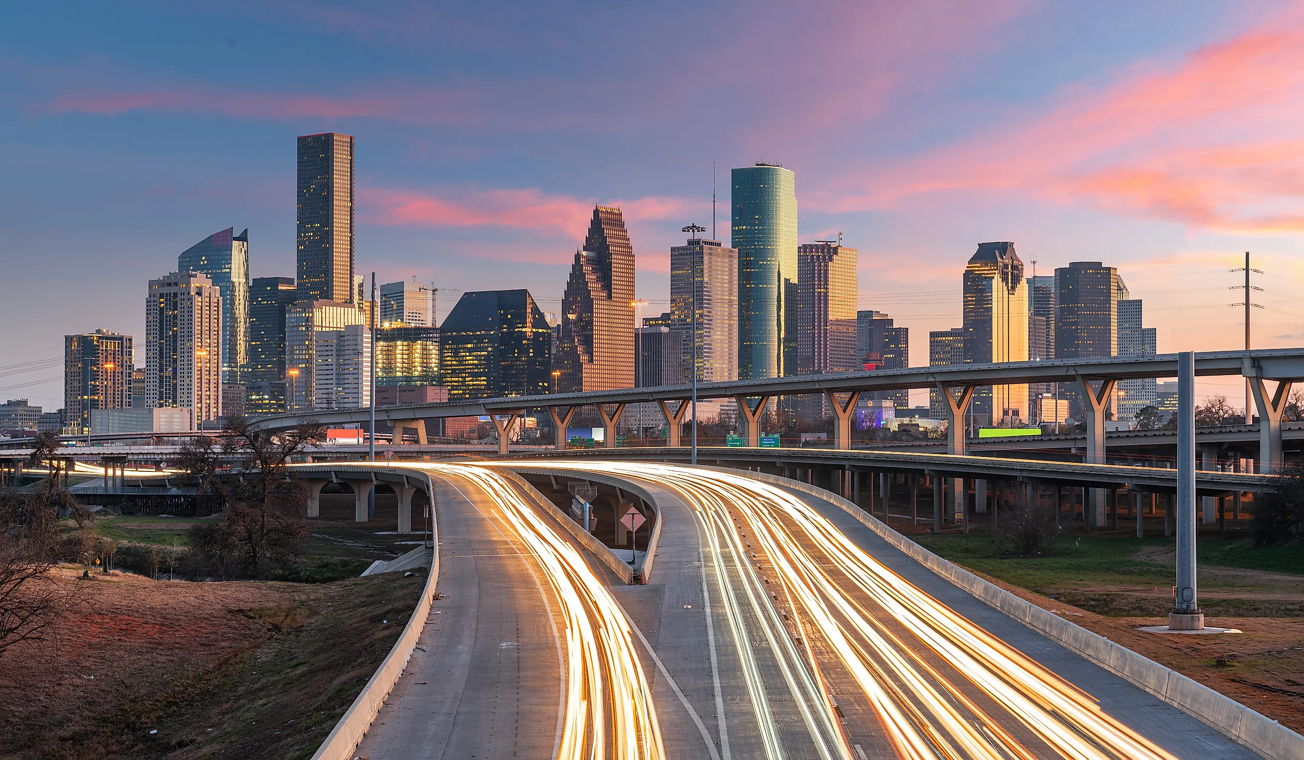 Houston, Texas, USA downtown skyline over the highways at dusk.