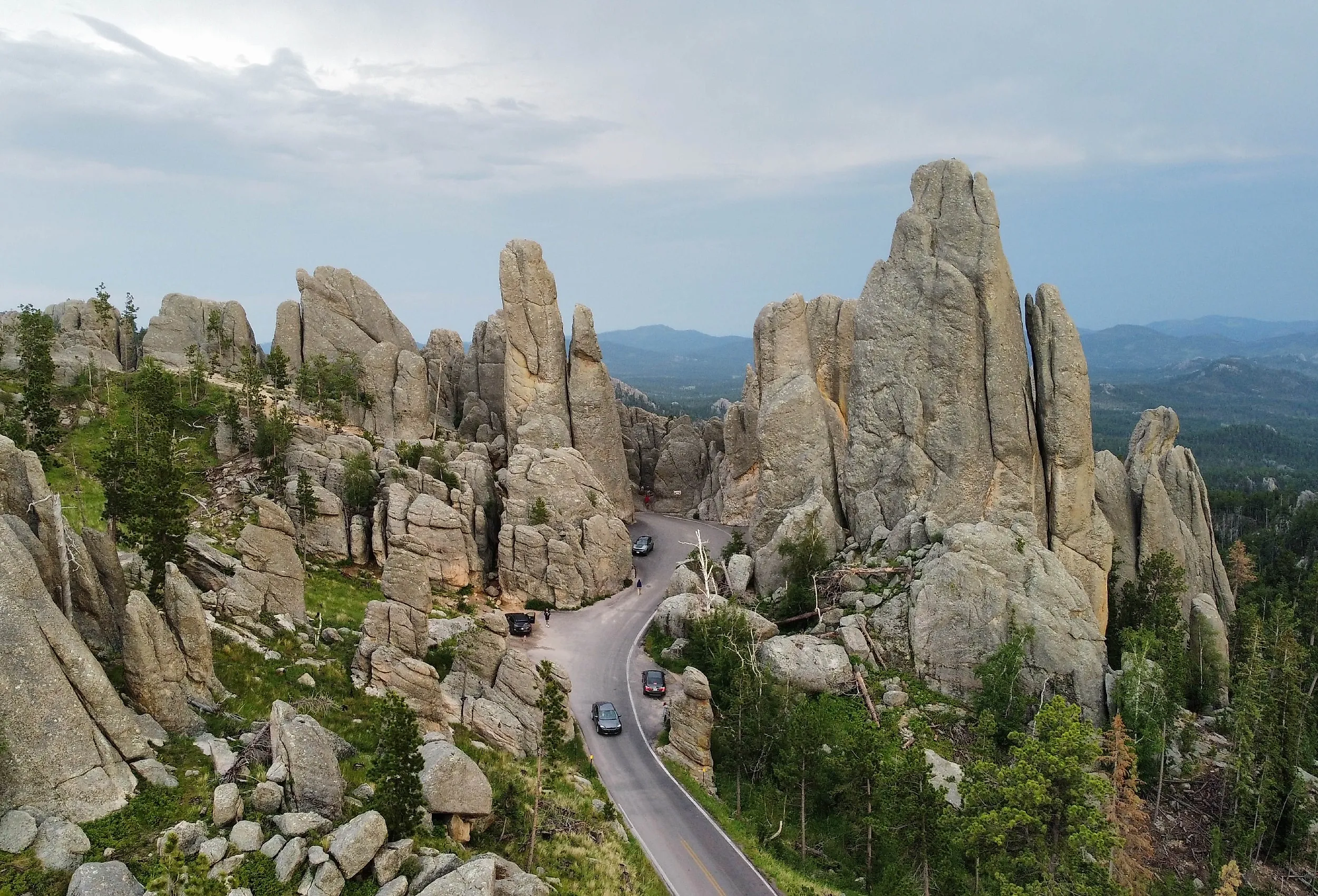 The Needles Highway in South Dakota, with winding road passing through towering, needle-like rock formations.