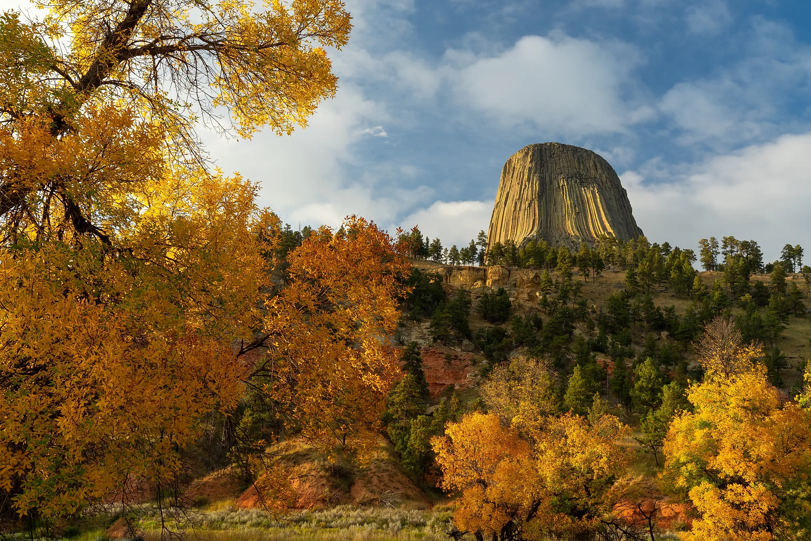 Fall Foliage frames the Devils Tower National Monument in Wyoming.