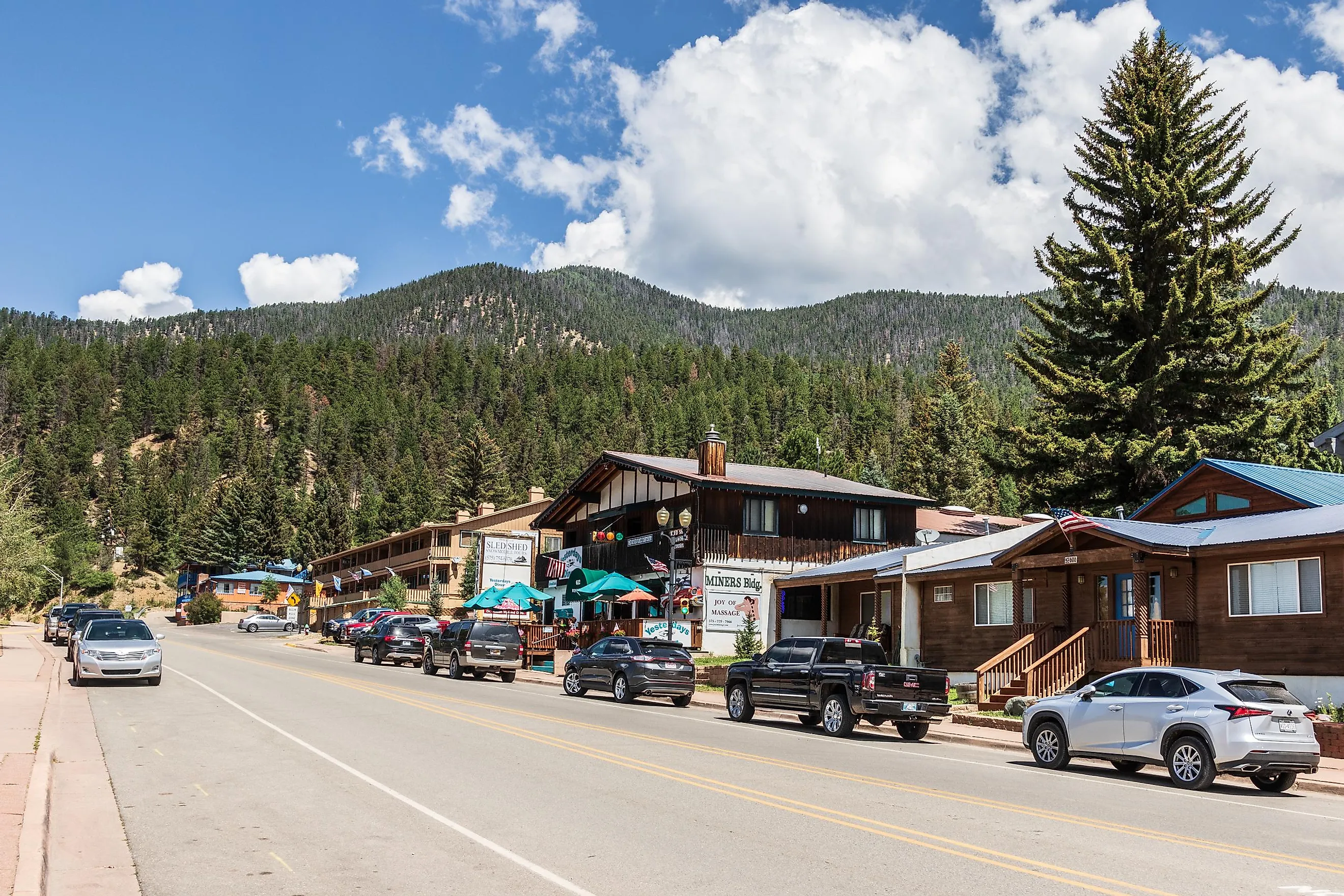 Main Street of Red River, New Mexico, with mountains in background.