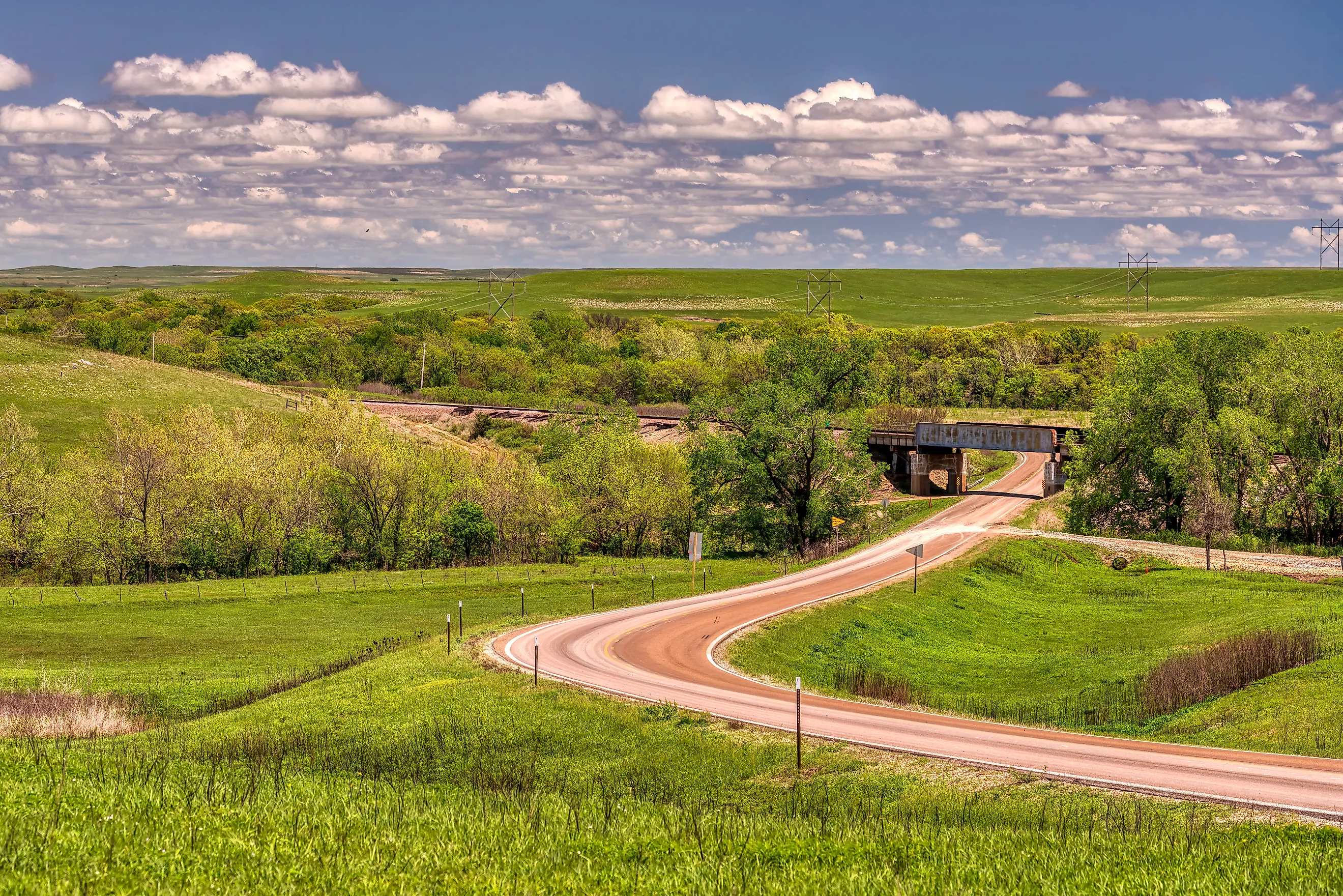 Green pasture land stretching across the Flint Hills of Kansas.