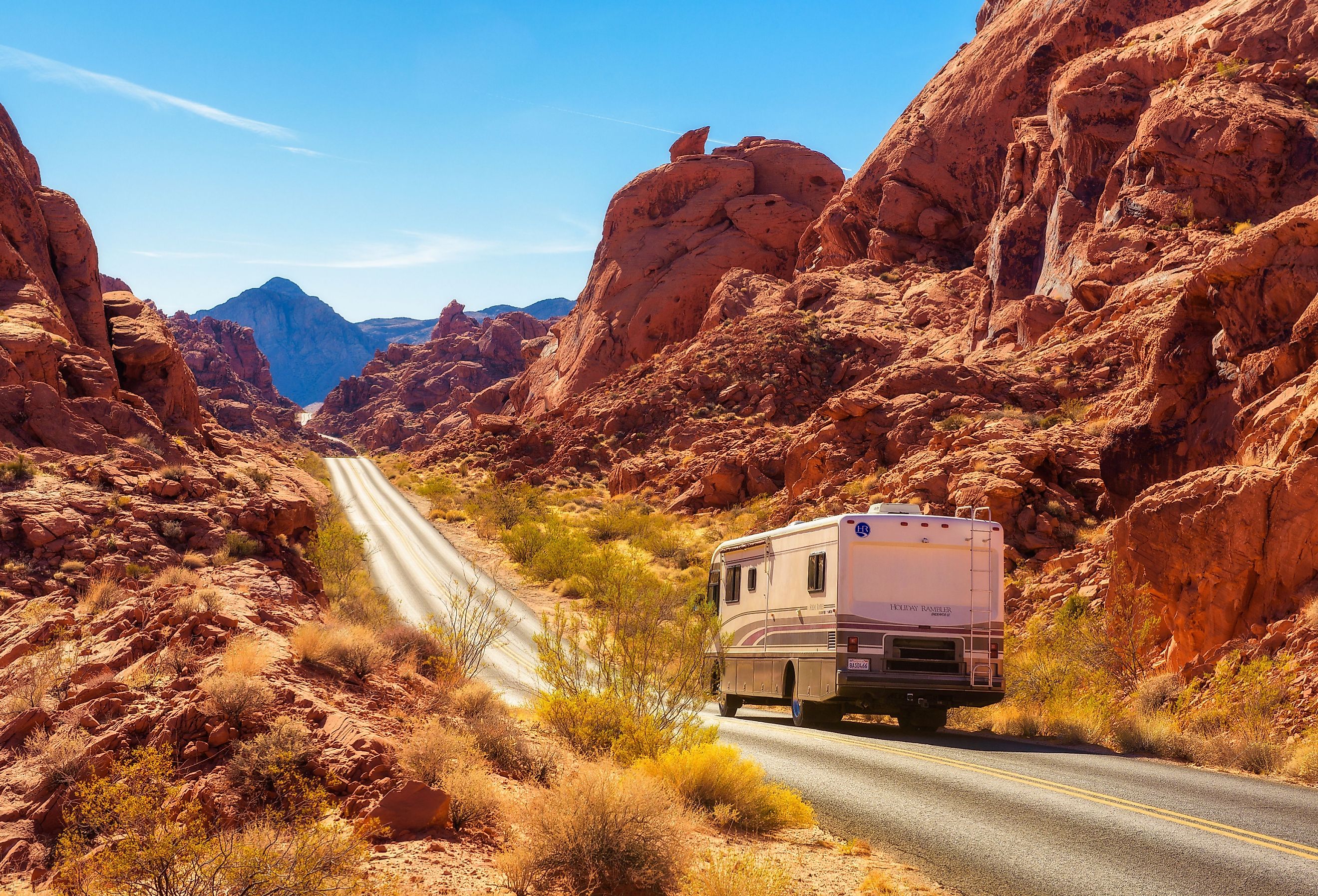 Motorhome trailer traveling on the road in Valley of Fire in Nevada. Image credit Nick Fox via Shutterstock.