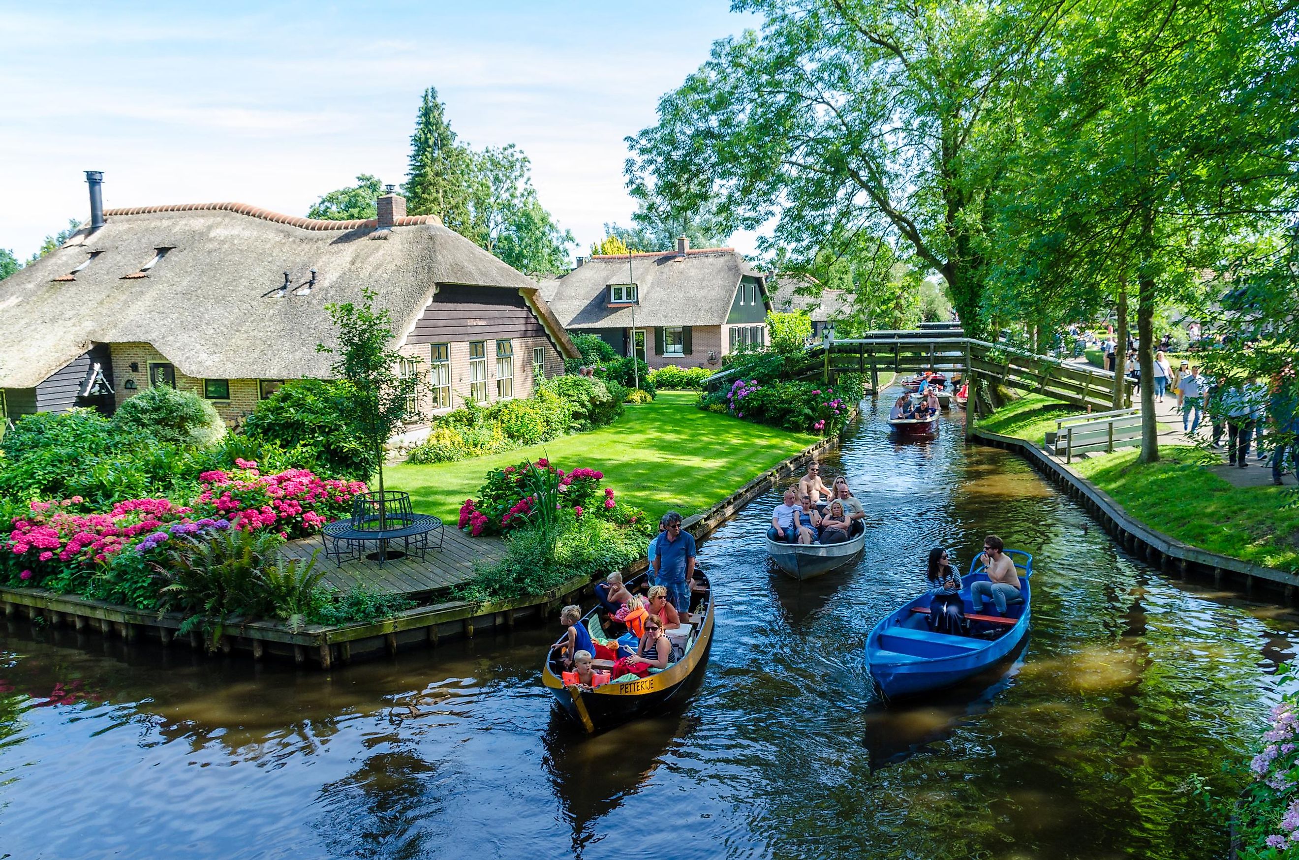 View of a canal and waterside houses in Giethoorn, Netherlands. Editorial credit: rob3rt82 / Shutterstock.com