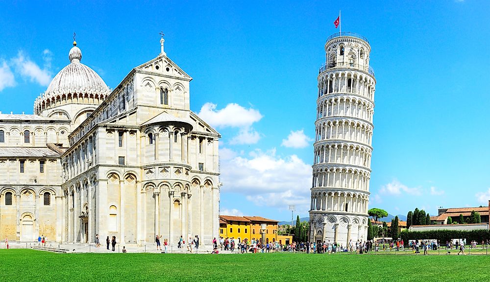 The Learning Tower of Pisa (right) beside the Pisa Cathedral.