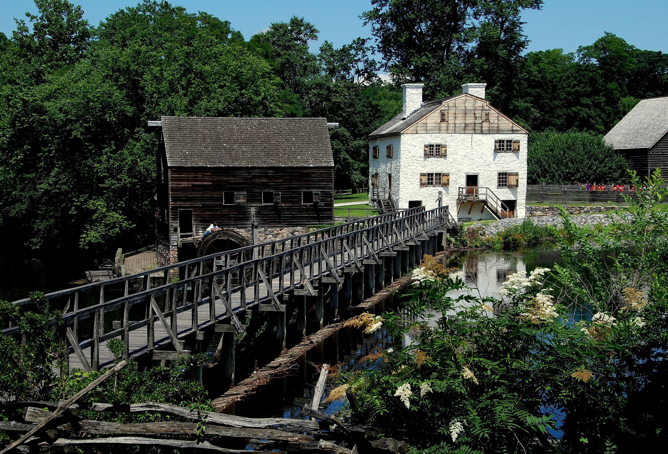 Mill Pond Bridge, wooden grist mill at Philipsburg Manor, Sleepy Hollow, New York. Image credit LEE SNIDER PHOTO IMAGES via Shutterstock