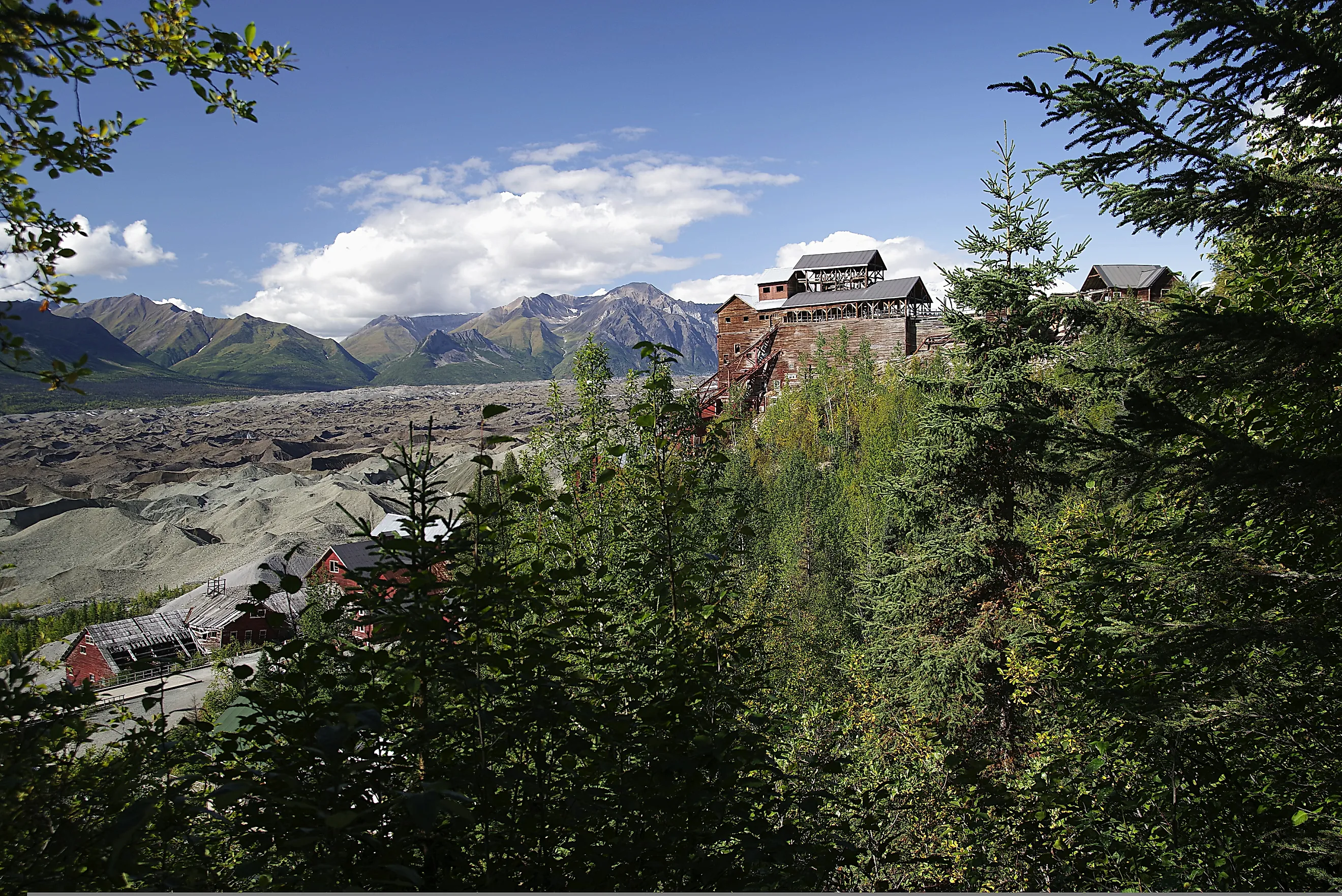The now defunct Kennecott Concentration Mill, part of the Kennecott Copper Mine, overlooks the Kennecott Glacier and the Wrangell Mountains in southeast Alaska. By Michael F. Wacht - Own work, CC BY-SA 4.0, https://commons.wikimedia.org/w/index.php?curid=