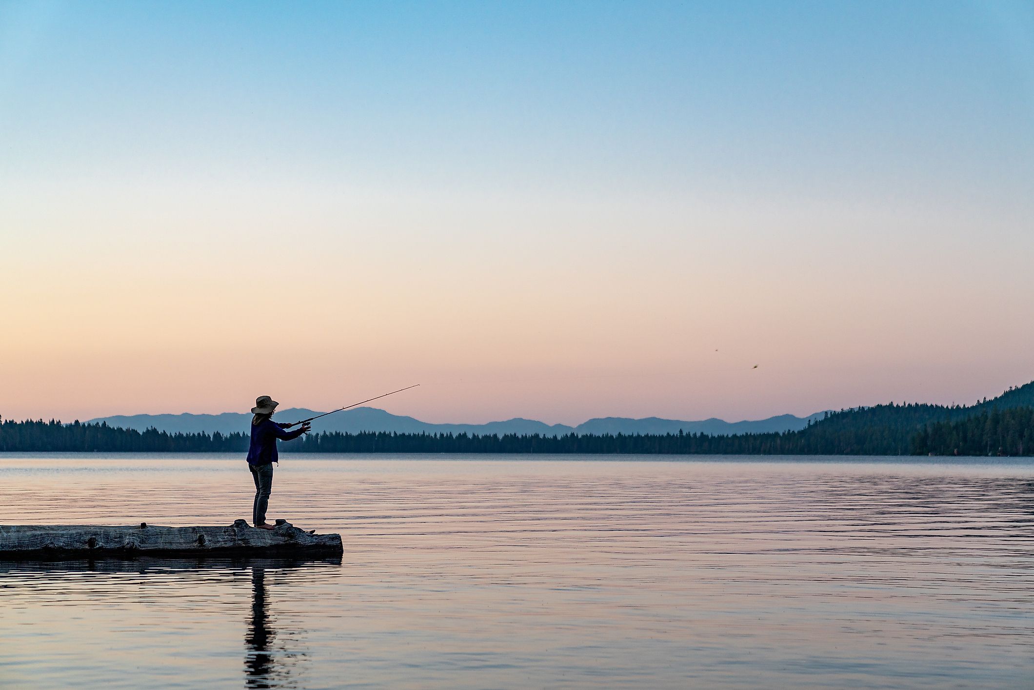 fishing from a log in Lake Tahoe, Nevada