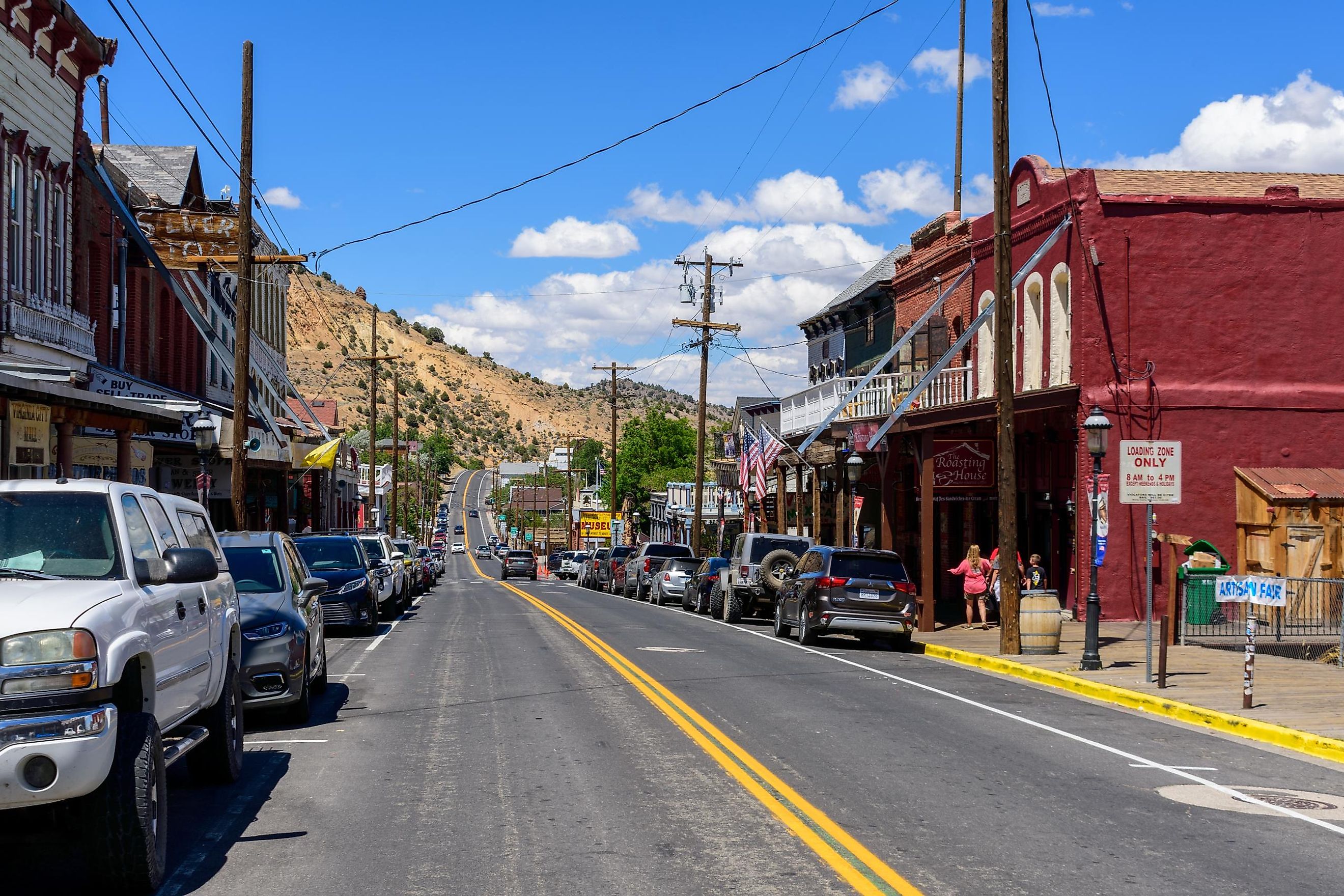 Scenic view of Victorian building on historic Main Street in downtown Virginia City, Nevada, with parked cars. Editorial credit: Michael Vi / Shutterstock.com