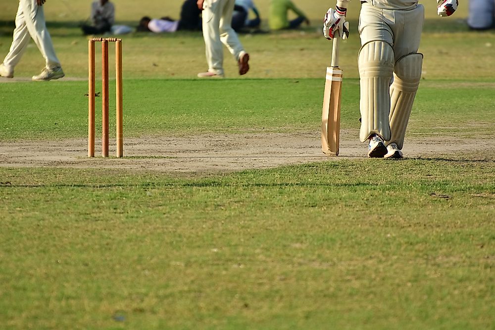 Players in cricket uniforms.
