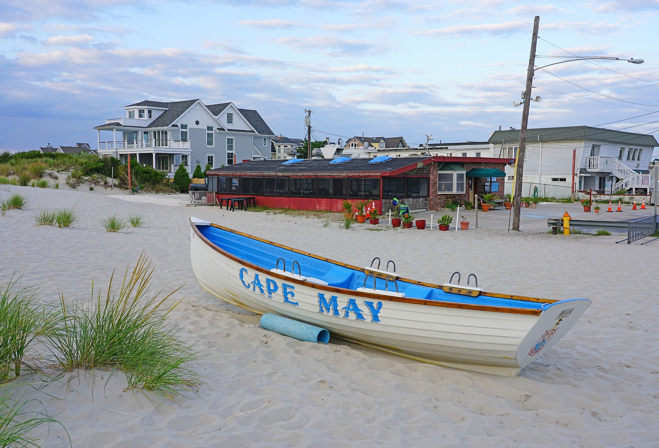 Cape May sign on the beach in Cape May, New Jersey. Image credit EQRoy via Shutterstock