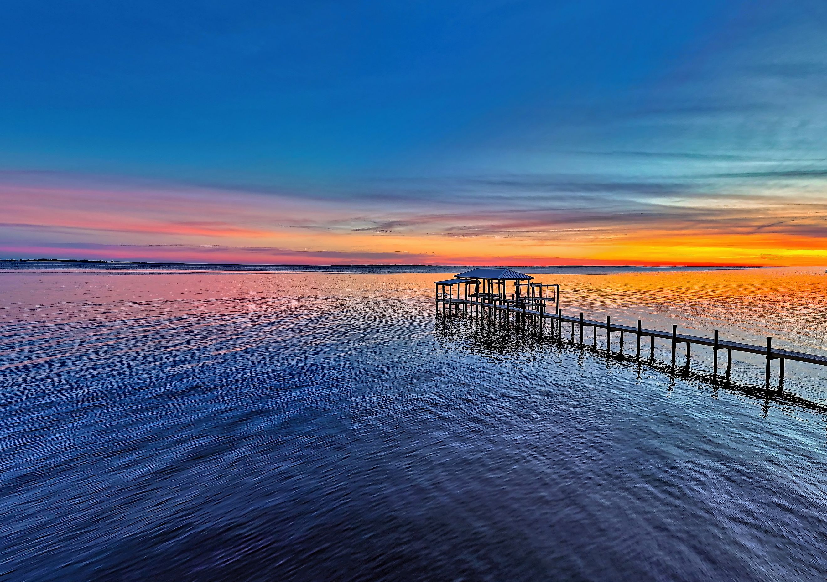 A stunning sunset over Apalachicola Bay in Carrabelle, Florida.