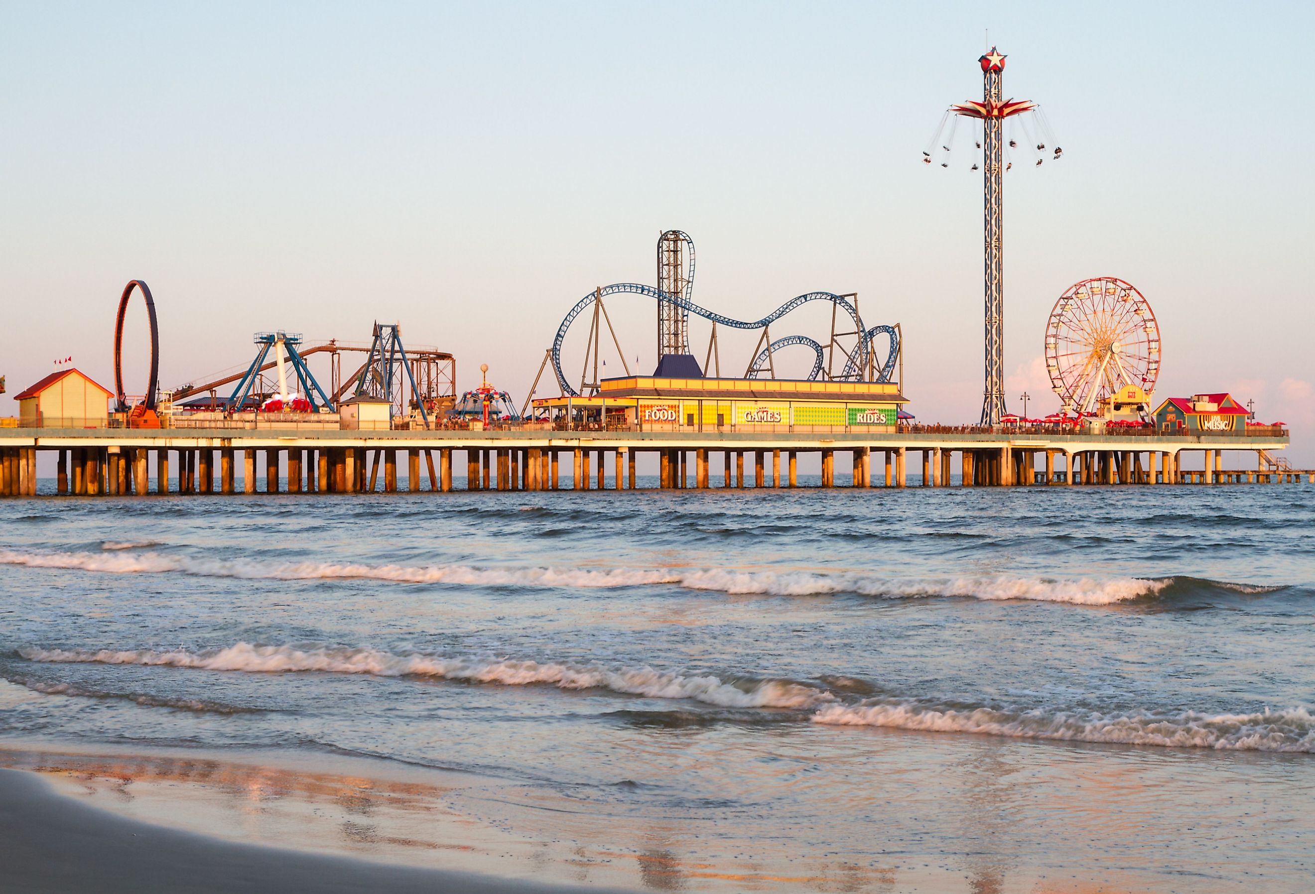 Galveston Island and beach with theme park on the pier. Image credit Carlos Bruzos Valin via Shutterstock.