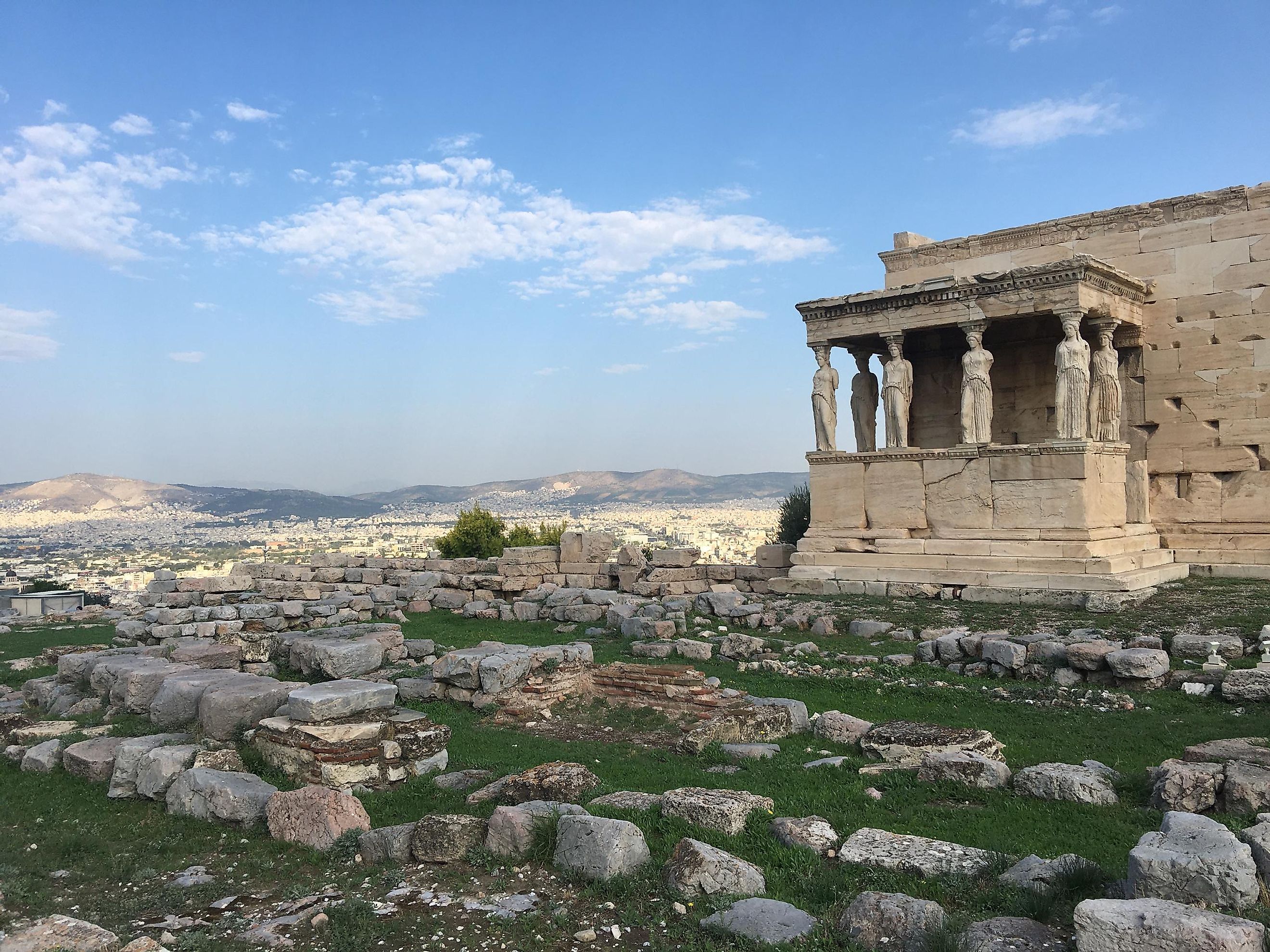 Part of the Erechtheion (or Temple of Athena Polias) standing above some rocky ruins, and well above the rest of Athens. The Acropolis was blessed with blue skies on this morning. Image: Andrew Douglas