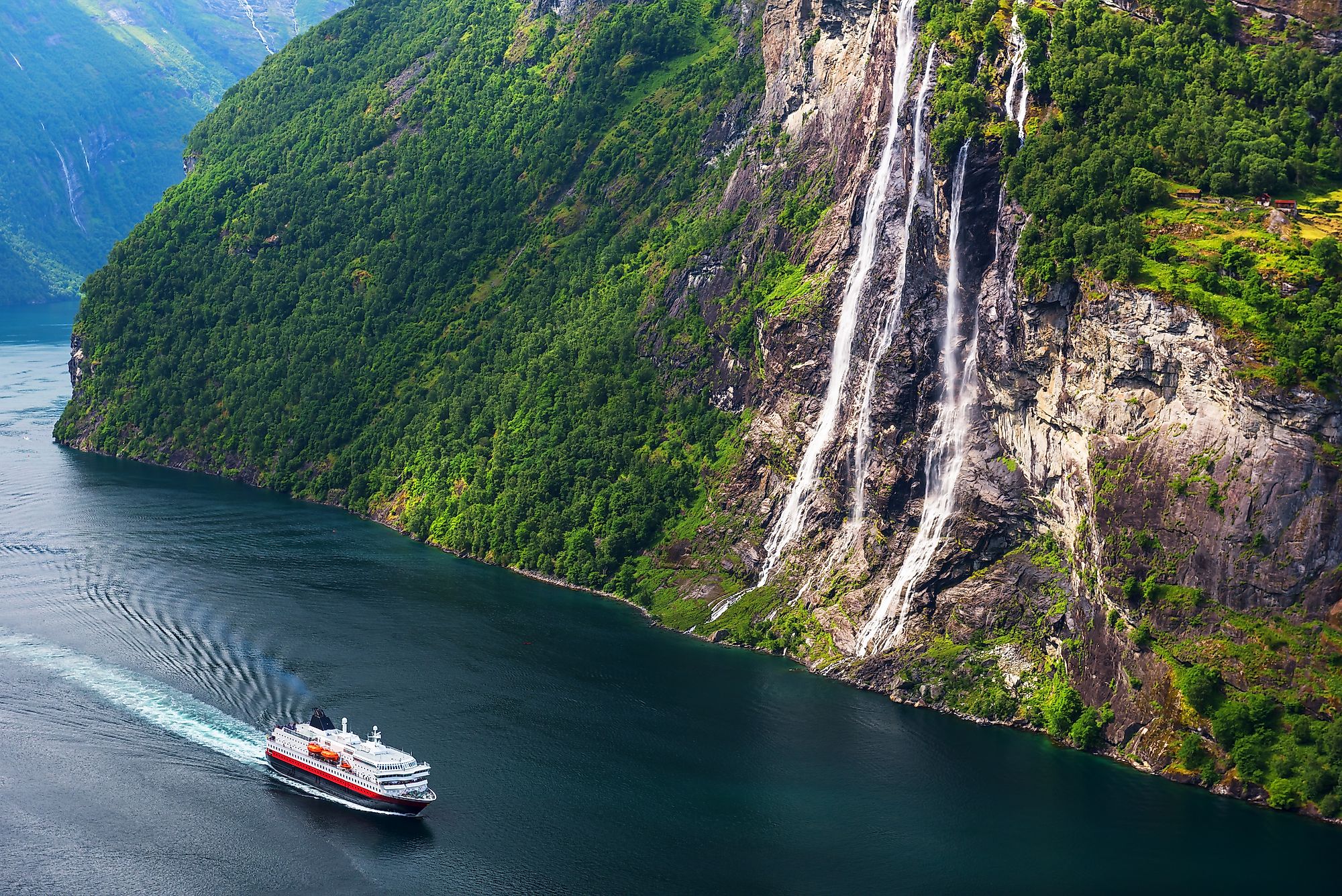 Breathtaking view of Sunnylvsfjorden fjord and famous Seven Sisters waterfalls, near Geiranger village in western Norway. Image credit: Smit/Shutterstock.com