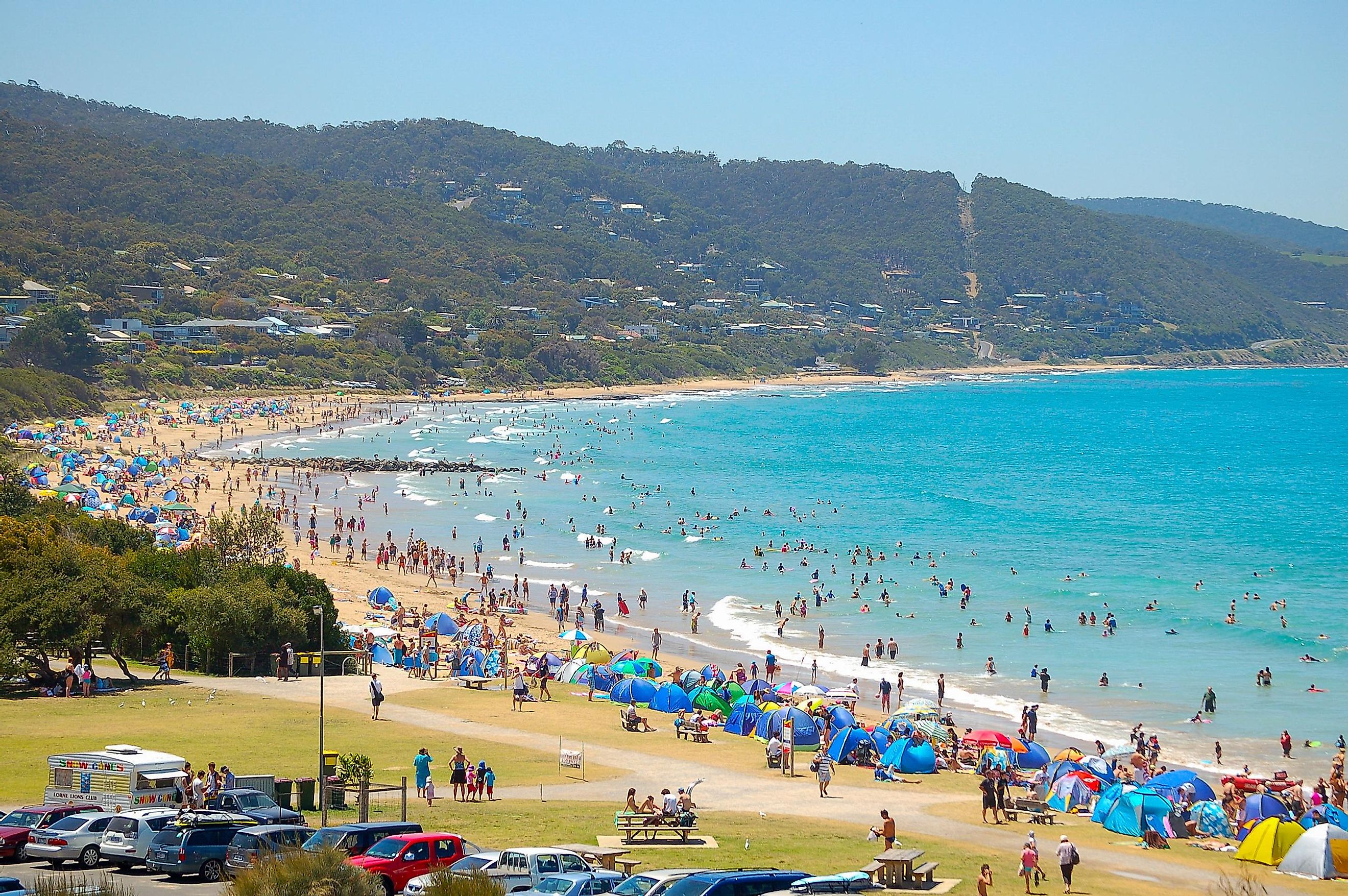 Vacationers enjoy the refreshing water in a summer heat wave on the beach of Lorne in Victoria, Australia