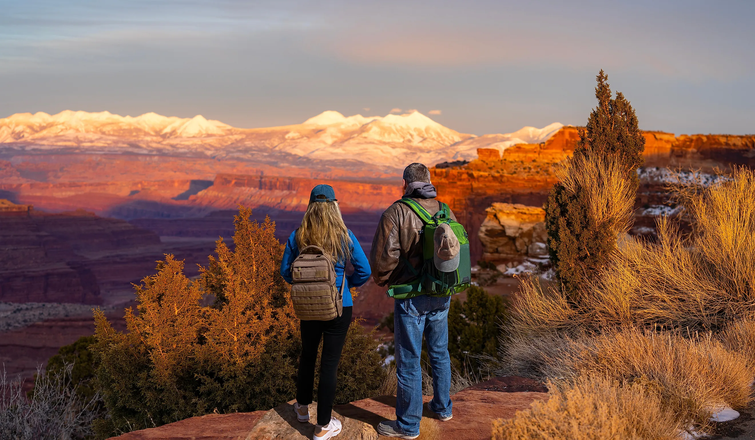 Canyonlands National Park at sunset against snow covered mountains. Utah, USA.