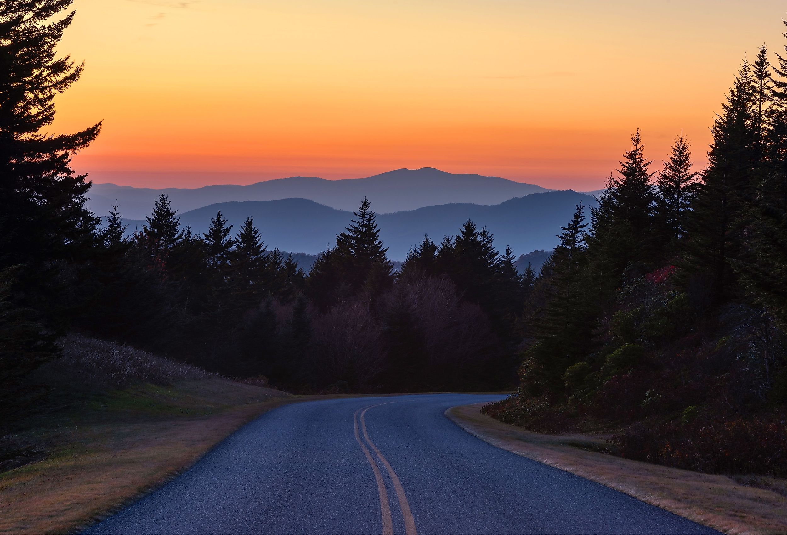 Dusk falls over the Blue Ridge Mountains along the Blue River Parkway. Image credit anthony heflin via Shutterstock.