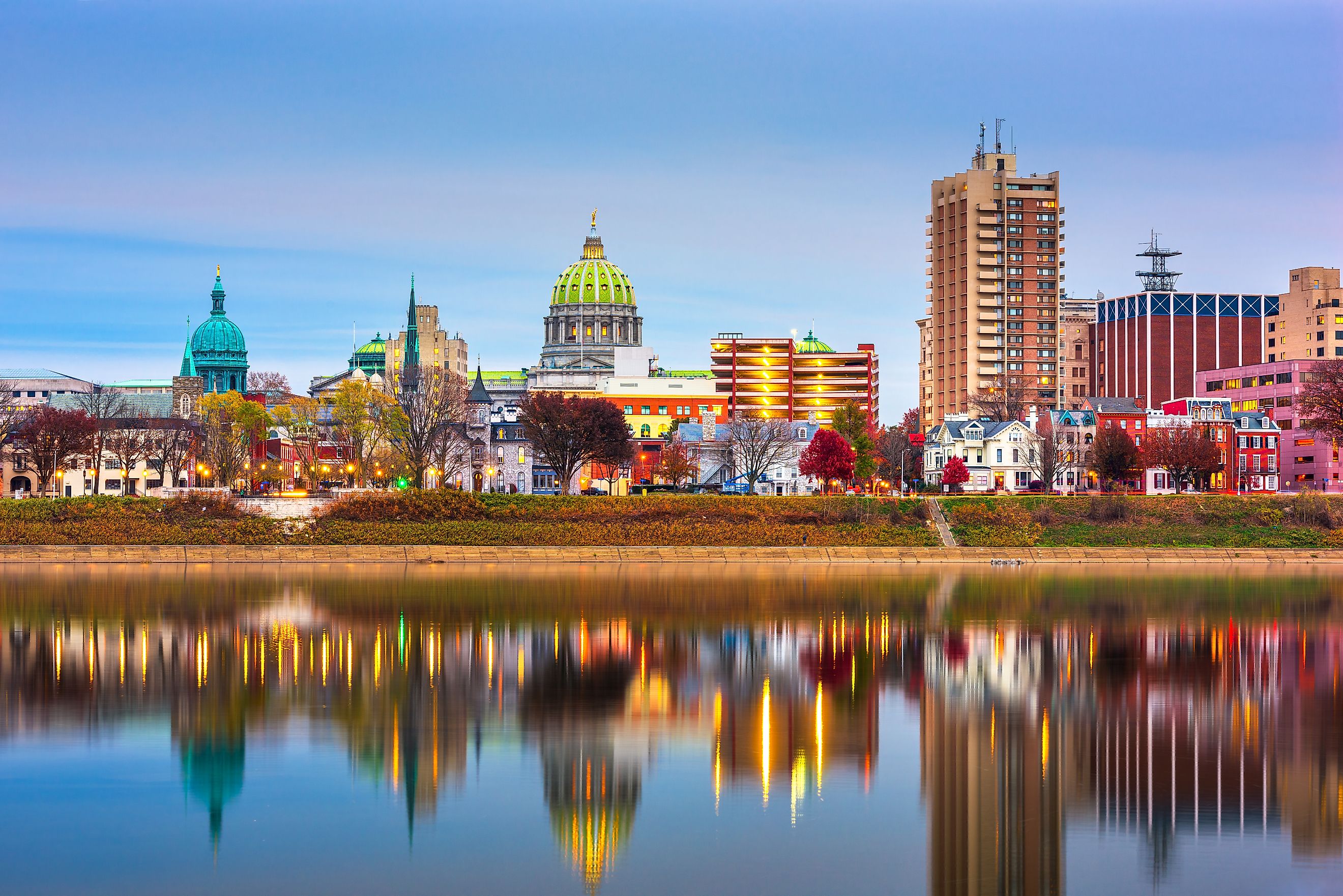 Harrisburg, Pennsylvania, USA skyline on the Susquehanna River at dusk.