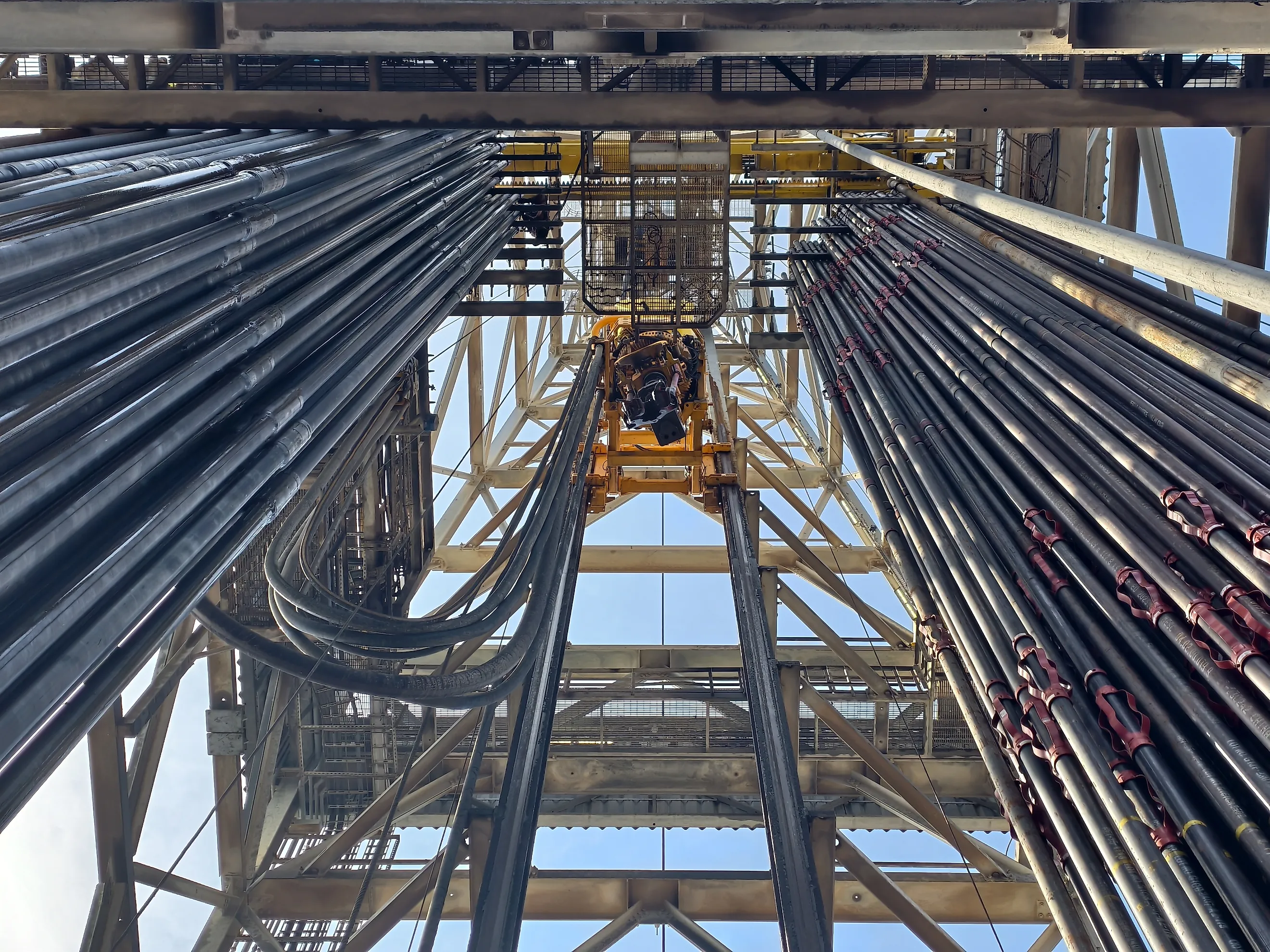 Top drive system (TDS) is a motorized unit suspended from the derrick to rotate the drill string, revolutionizing drilling by enabling faster, safer operations by replacing the traditional rotary table and Kelly system.