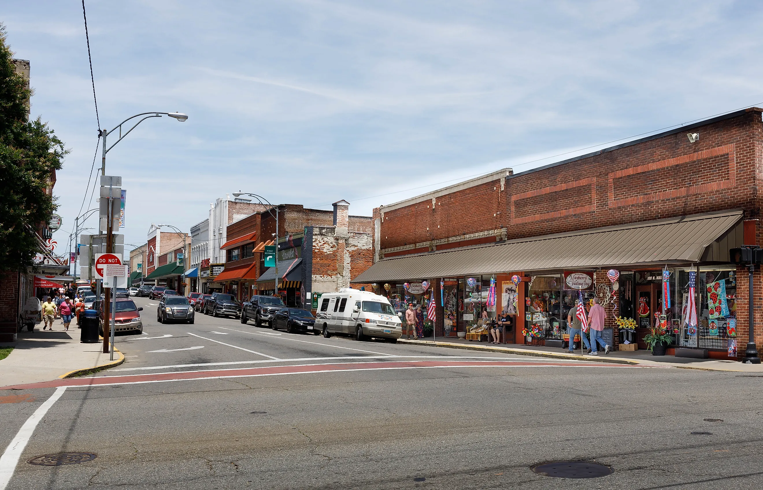 A wide-angle view down Main Street, showing colorful shops and numerous people walking, Mount Airy, North Carolina, via J. Michael Jones / Shutterstock.com