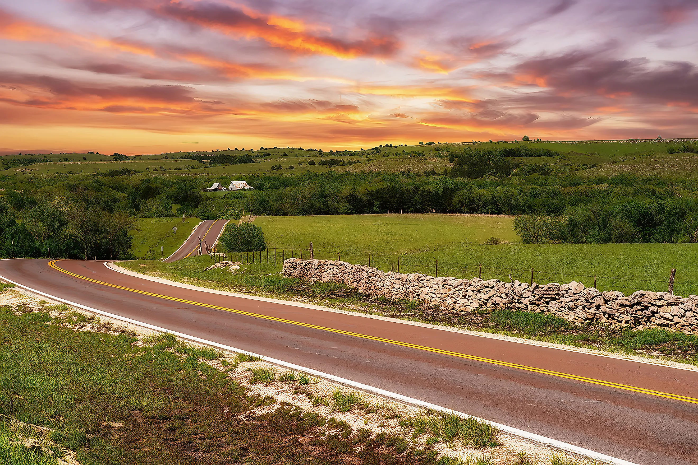 The sun sets on a ranch in the Flint Hills of Kansas