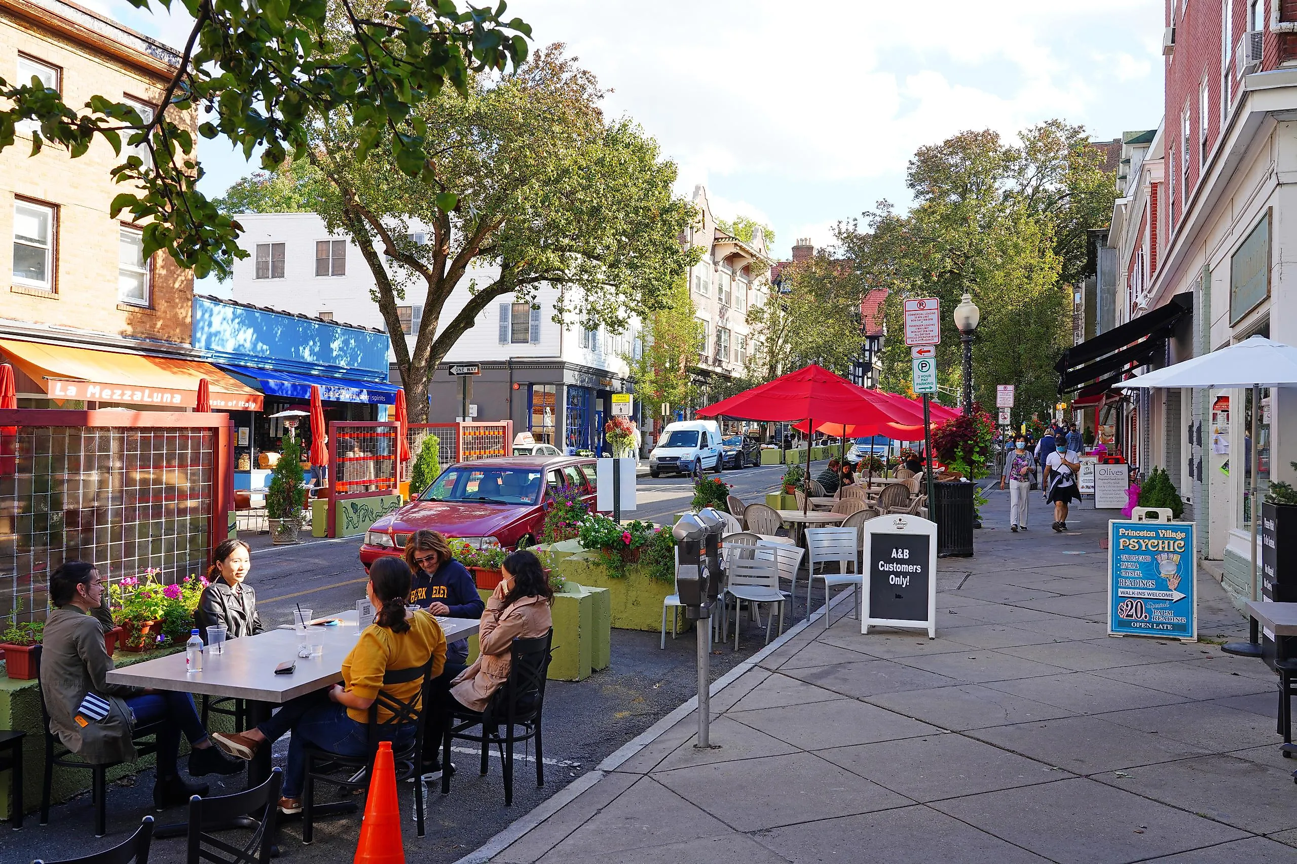View of people eating on outdoor patios on Witherspoon Street in downtown Princeton, New Jersey.