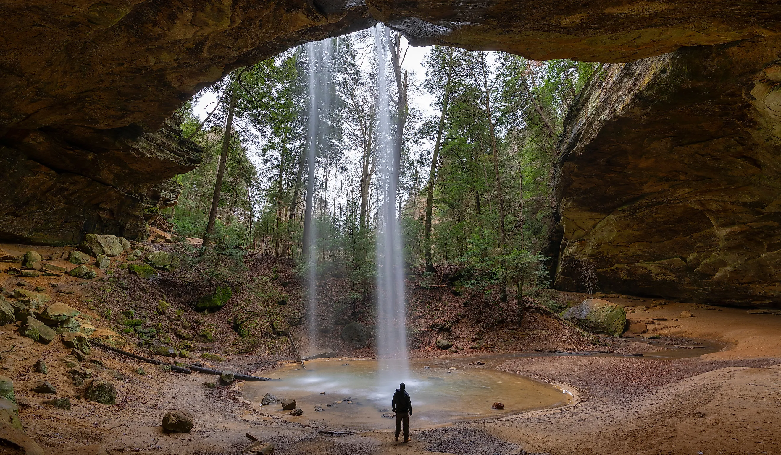 Hiker at Ash Cave in Hocking Hills, Ohio. 