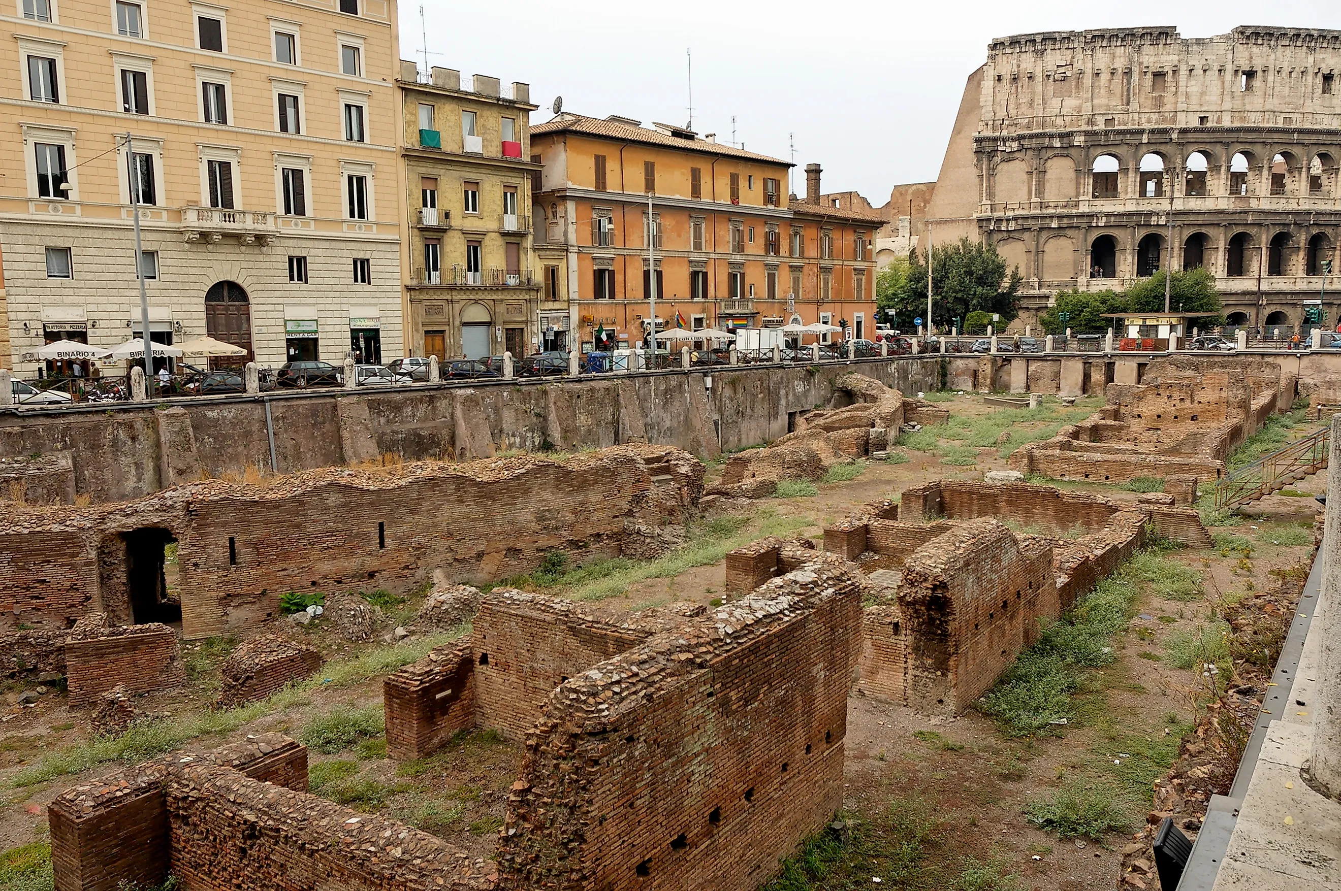 The Ludus magnus in Rome: barracks for gladiators built by Emperor Domitian (81–96 CE), view from Via Labicana. In the background, the Colosseum.