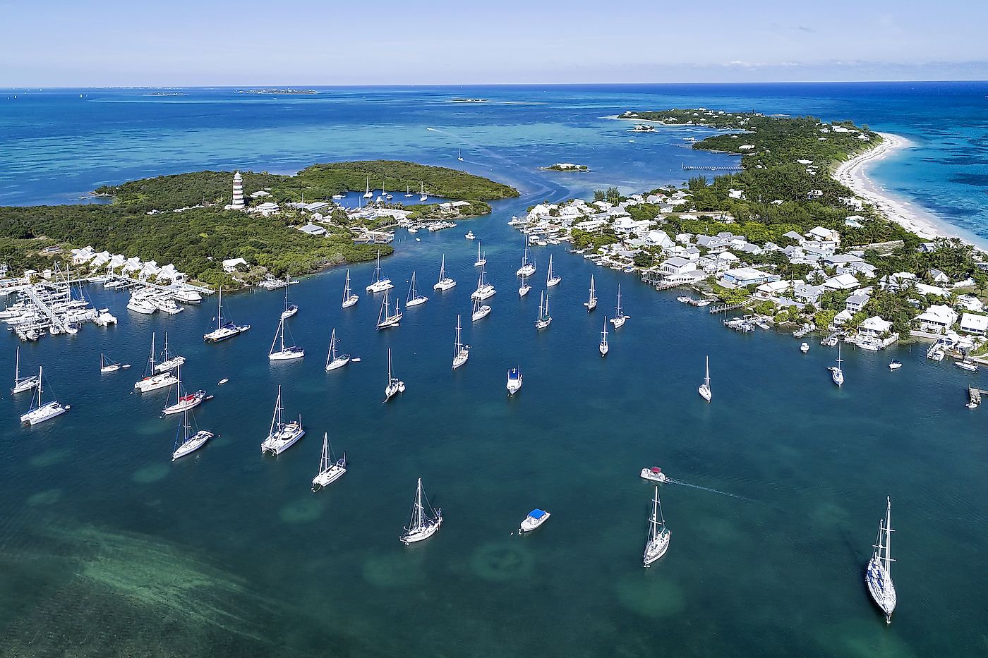 Aerial view of the harbour and lighthouse in Hope Town on Elbow Cay off the island of Abaco, Bahamas. Image credit: pics721/Shutterstock.com