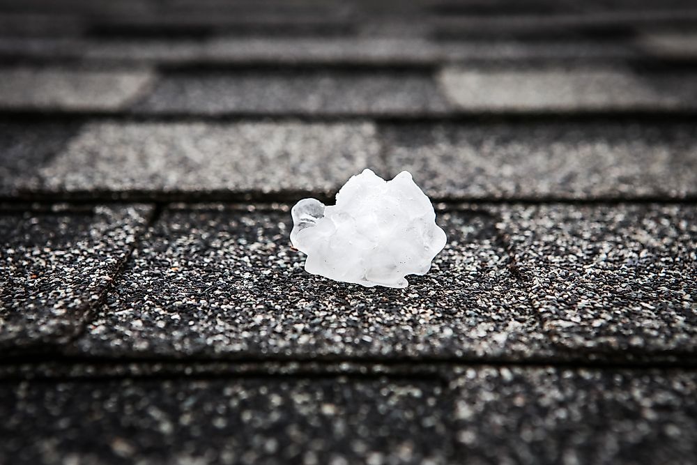 A ball of hail on the pavement after a hailstorm.