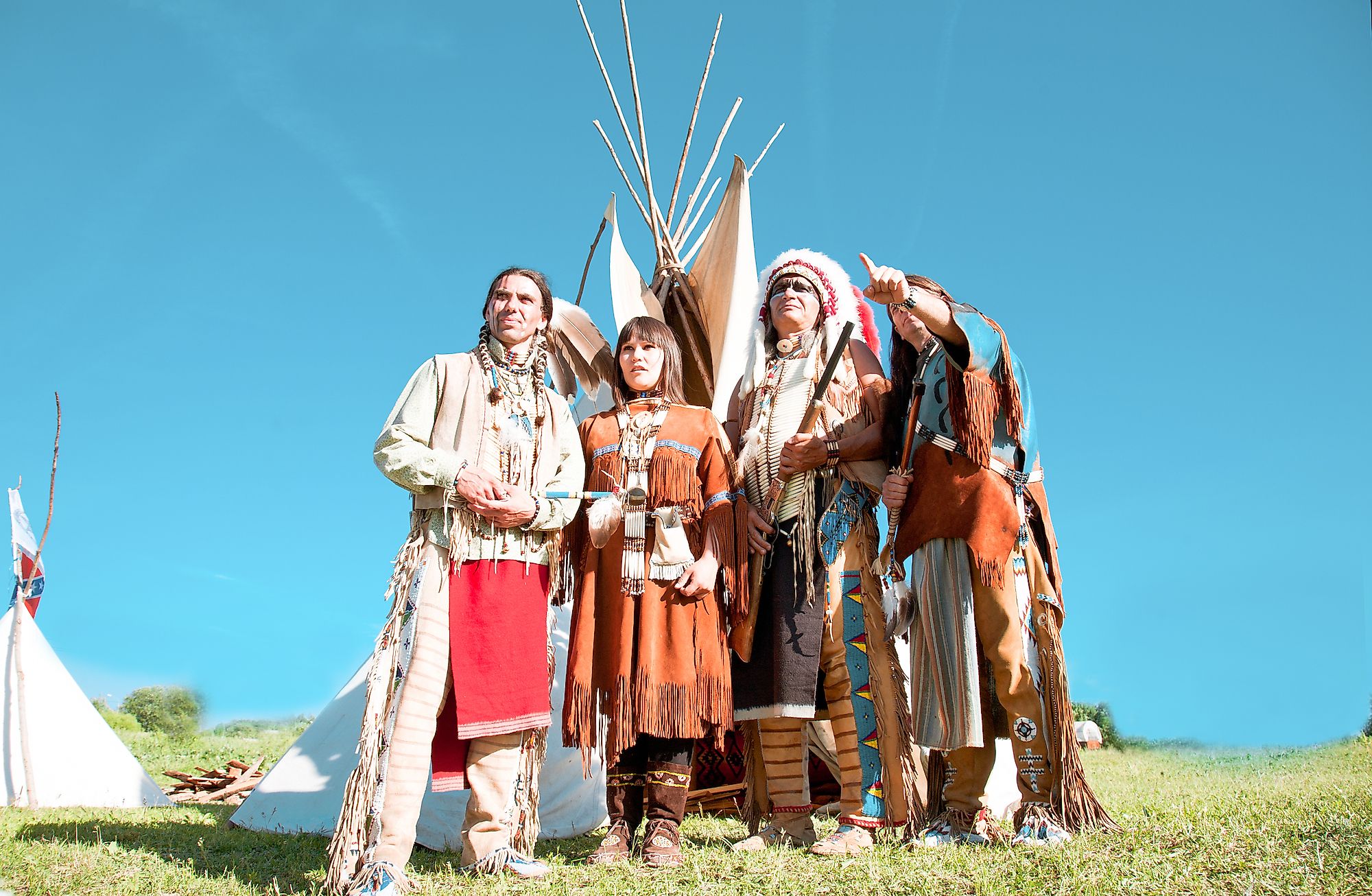 Group of North American Indians about a wigwam. Image credit: Shchipkova Elena/Shutterstock.com
