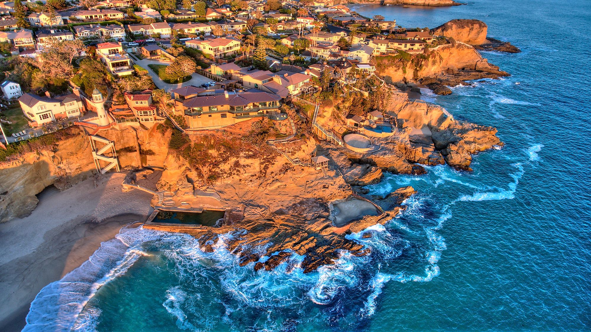 Aerial view of Three Arch Bay in Laguna Beach, Orange County, California during twilight.